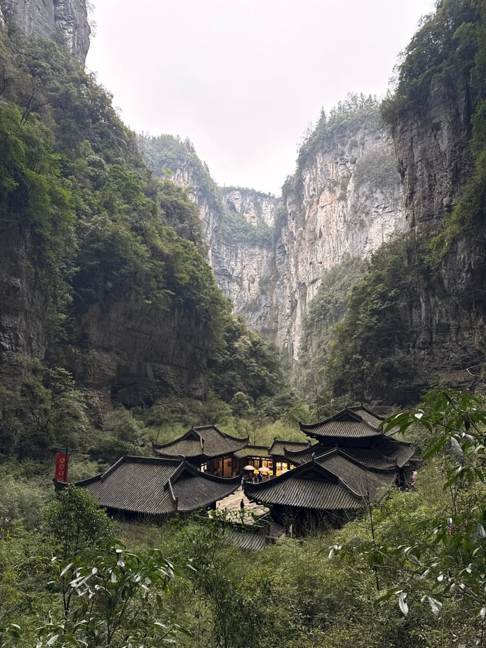 Tourist documents Three Natural Bridges karst formations in Wulong