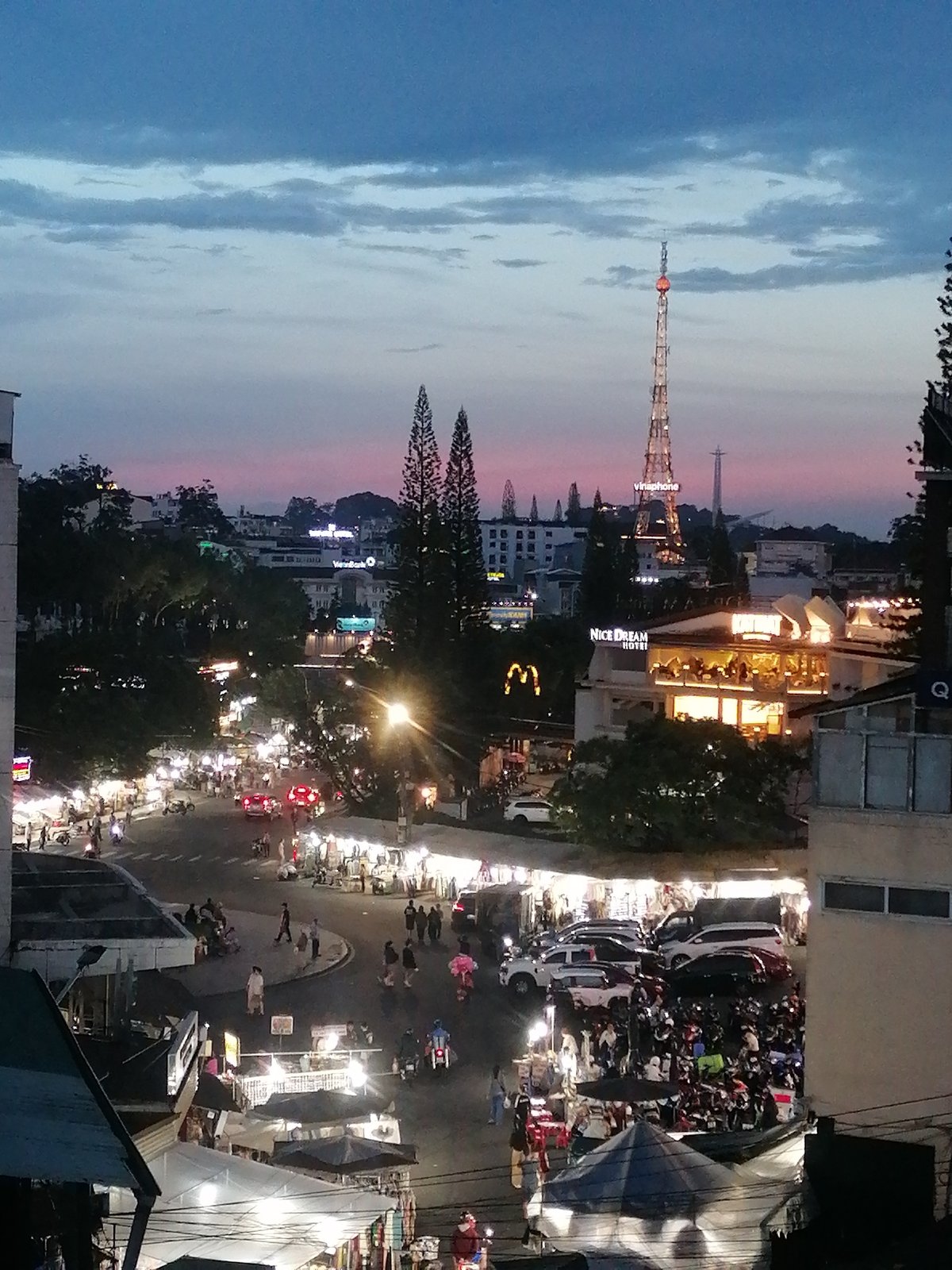 Daily life unfolds across Da Lat streets and waterways