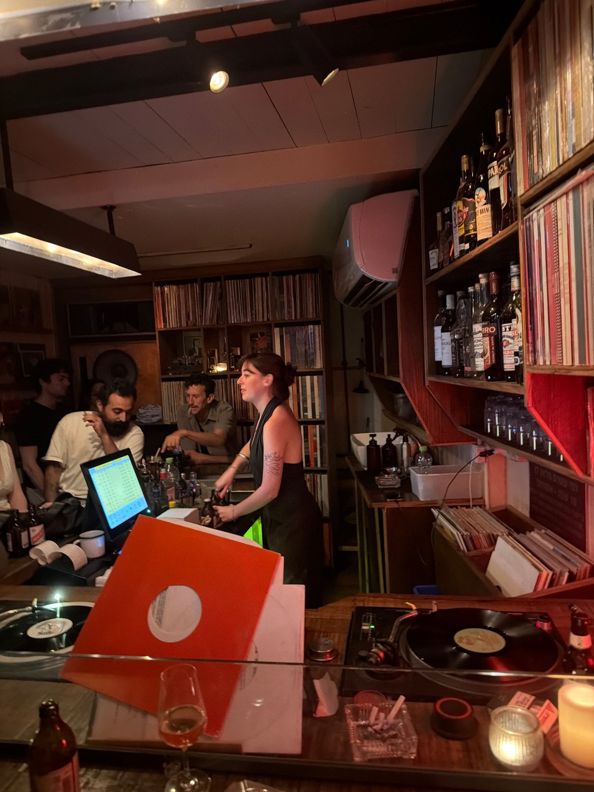 Man operates vinyl record bar in Tel-Aviv evening