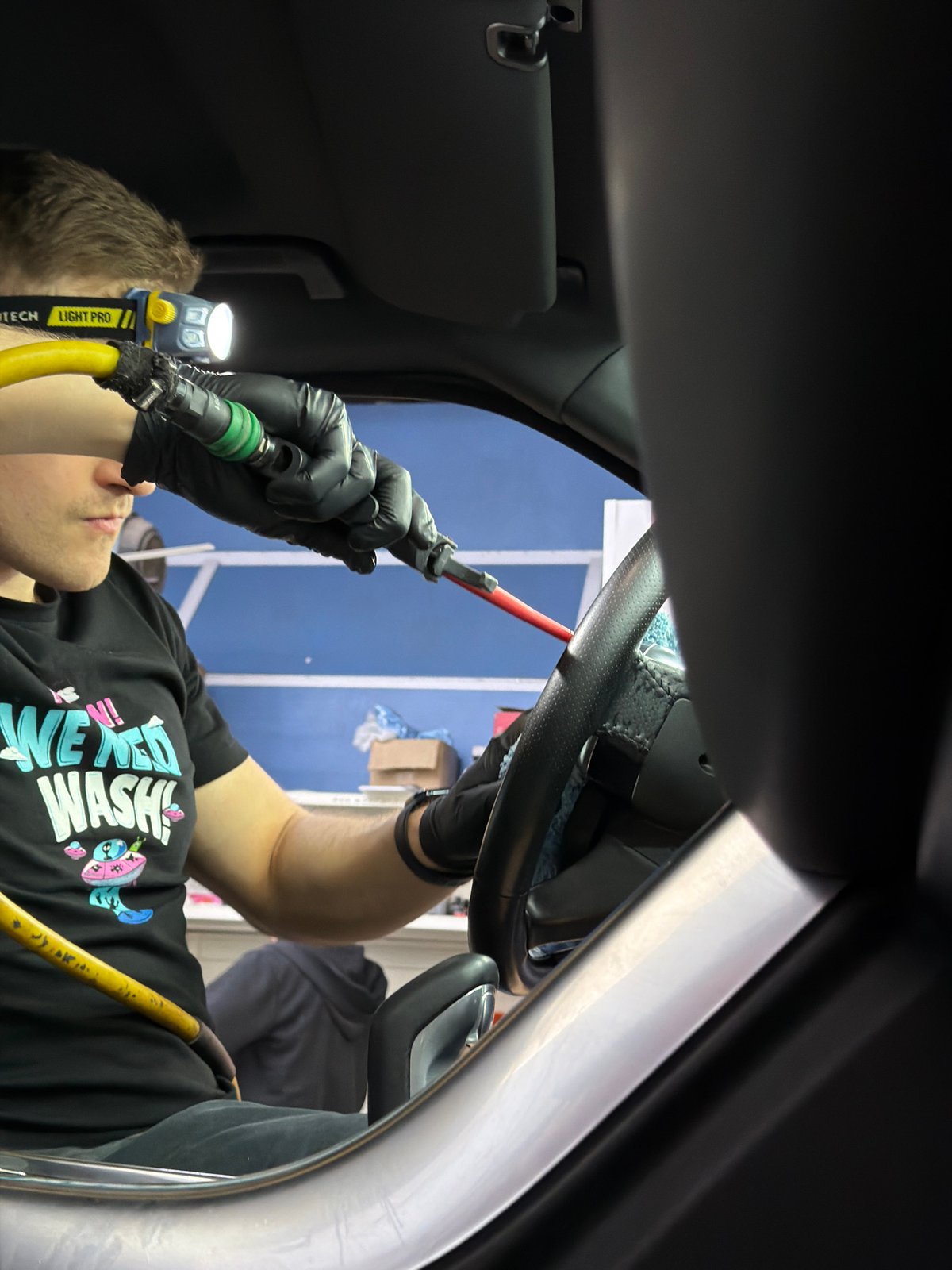 Professional car detailing service documented in Krasnoyarsk garage