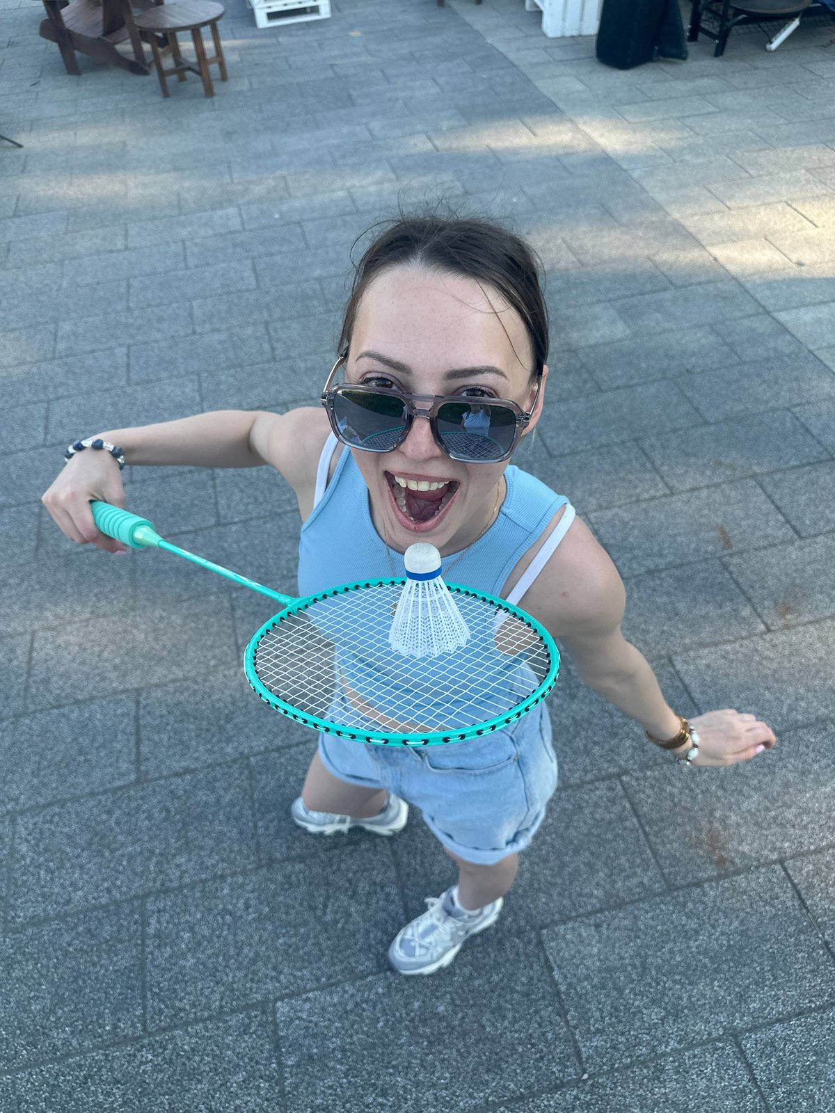 Casual badminton and summer greenery in a Moscow park