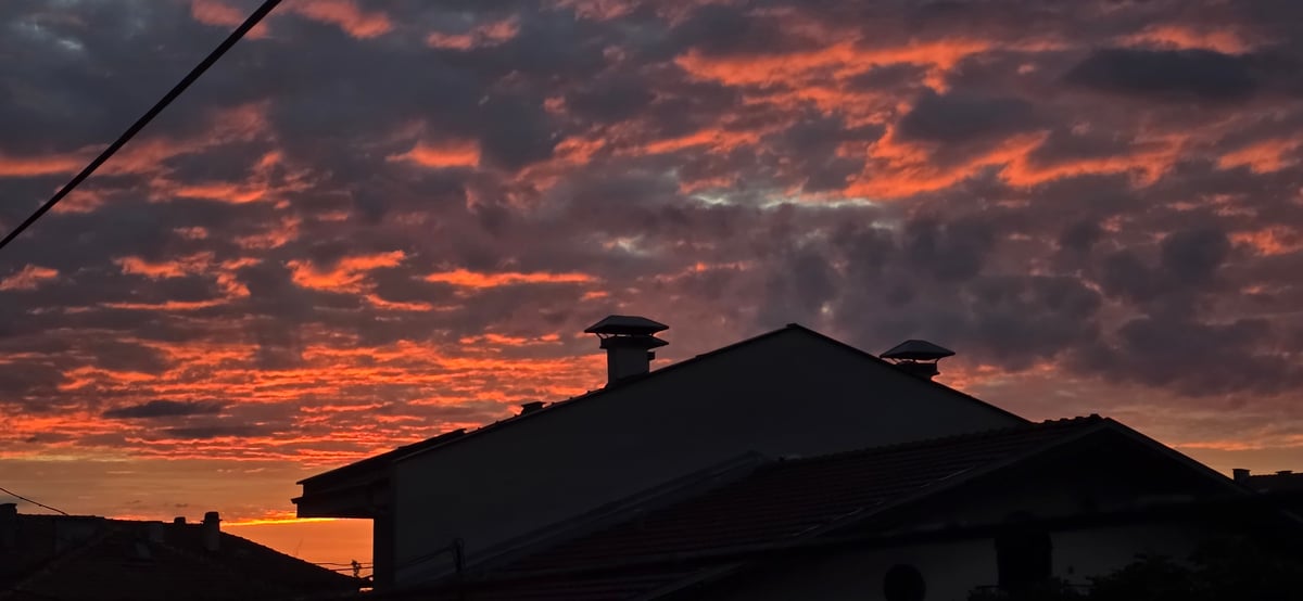 Dramatic sunset displays vivid colors over Plovdiv, Bulgaria
