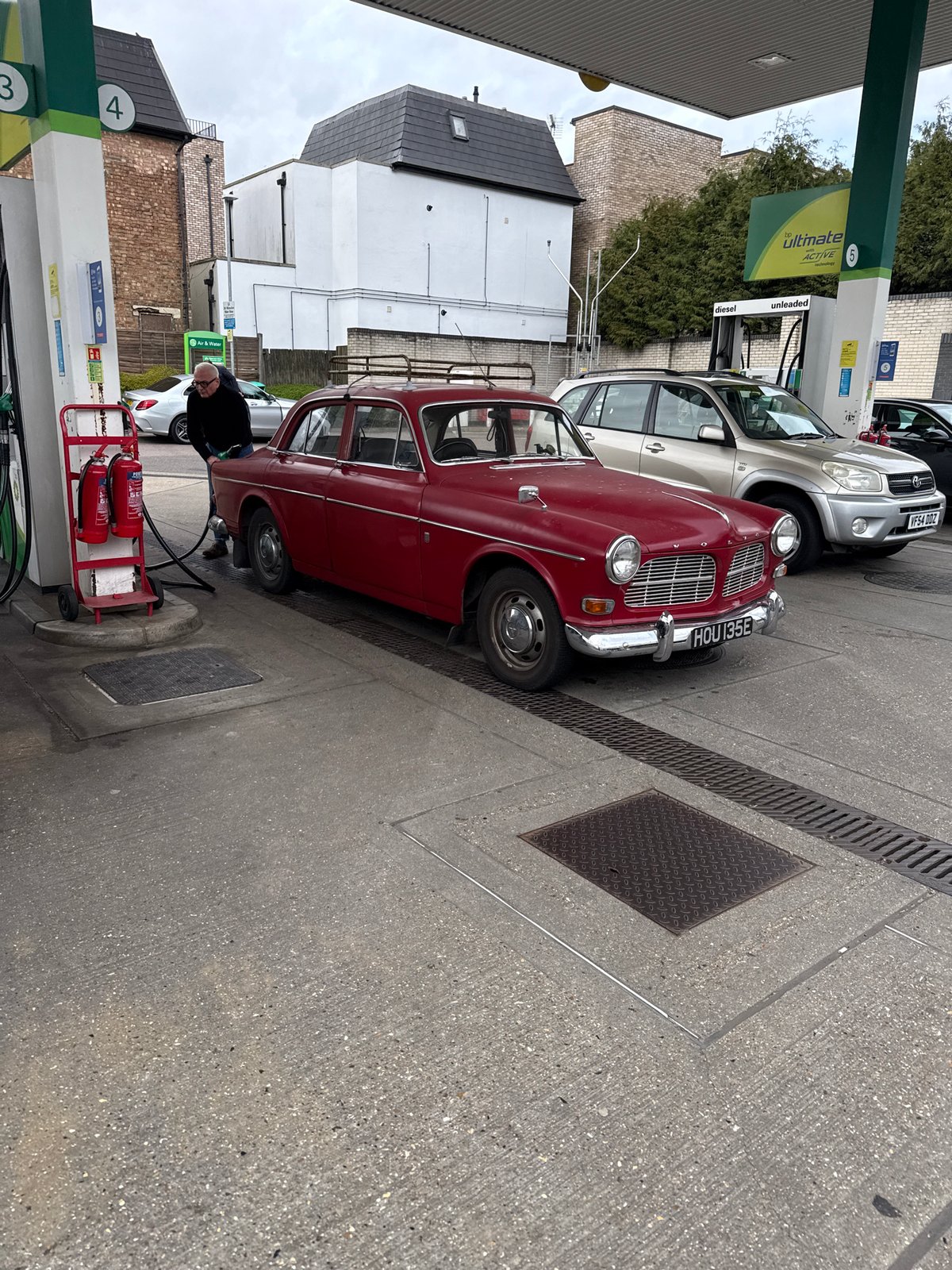 Vintage car and SUV spotted at London BP station