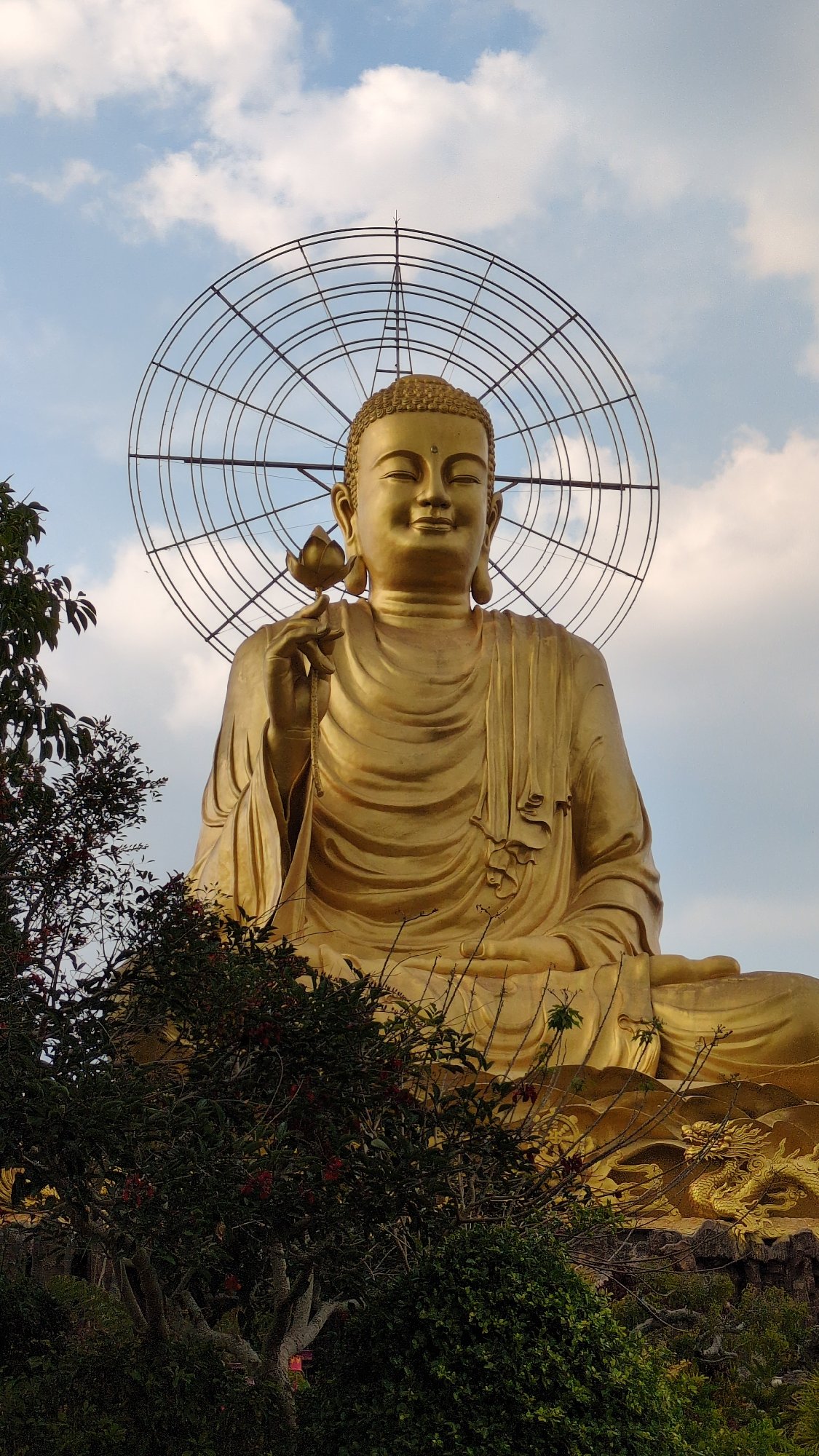 Buddha statue with yellow cloth observed in Đà Lạt