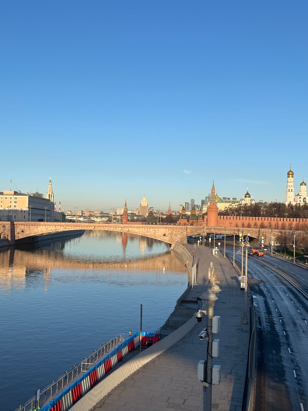 Early morning Kremlin reflection captured on Moscow riverbank