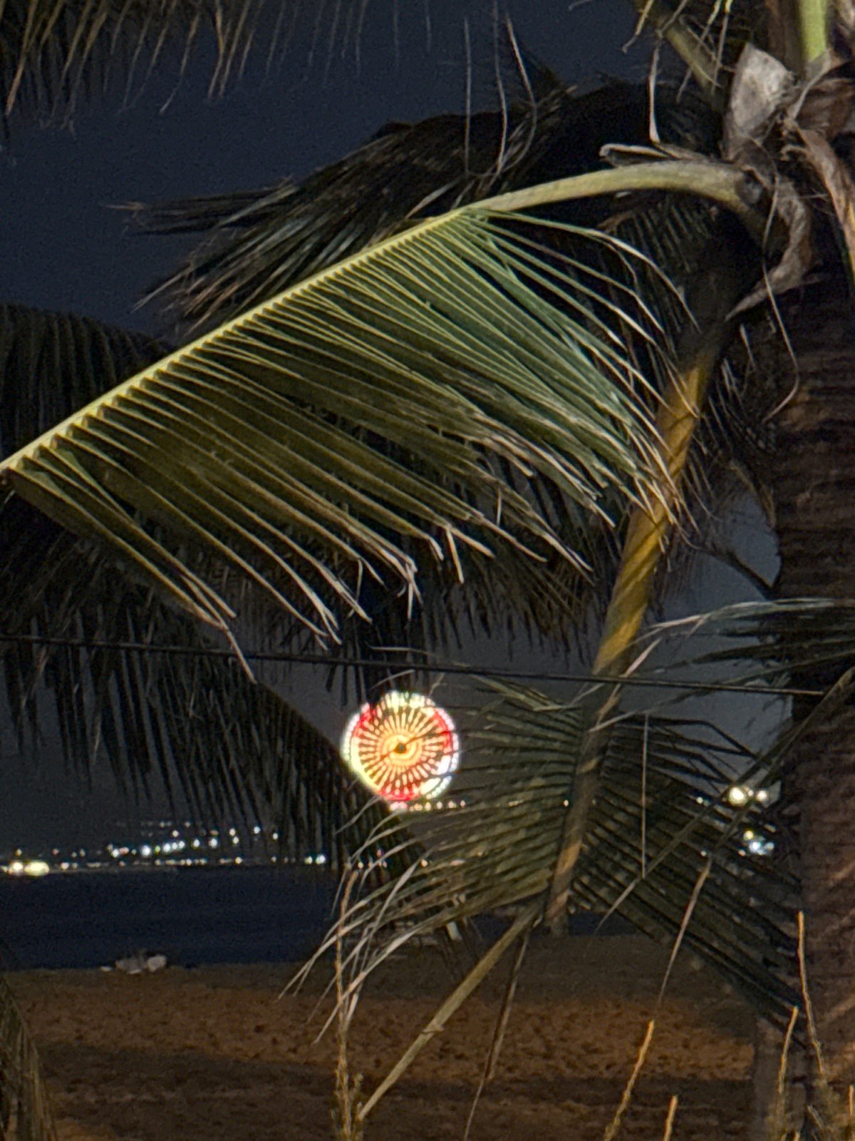 Nha Trang beachfront park at night, busy and lit up