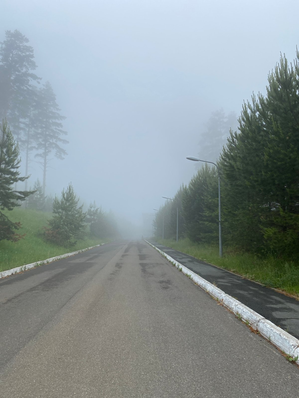 Dense fog blankets roads in Прикамский, Russia early morning