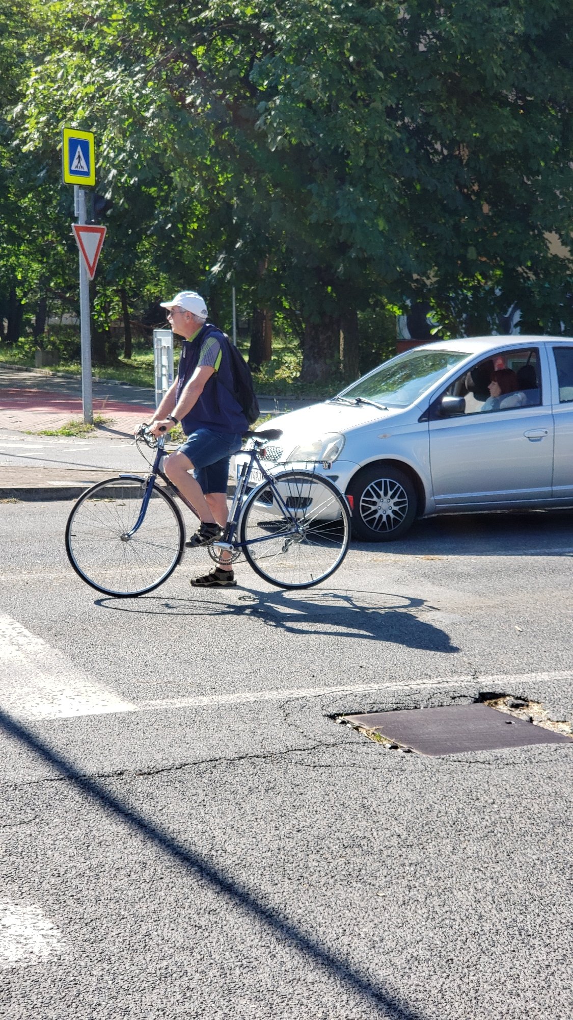 Quiet morning street life near a car dealership in Prešov