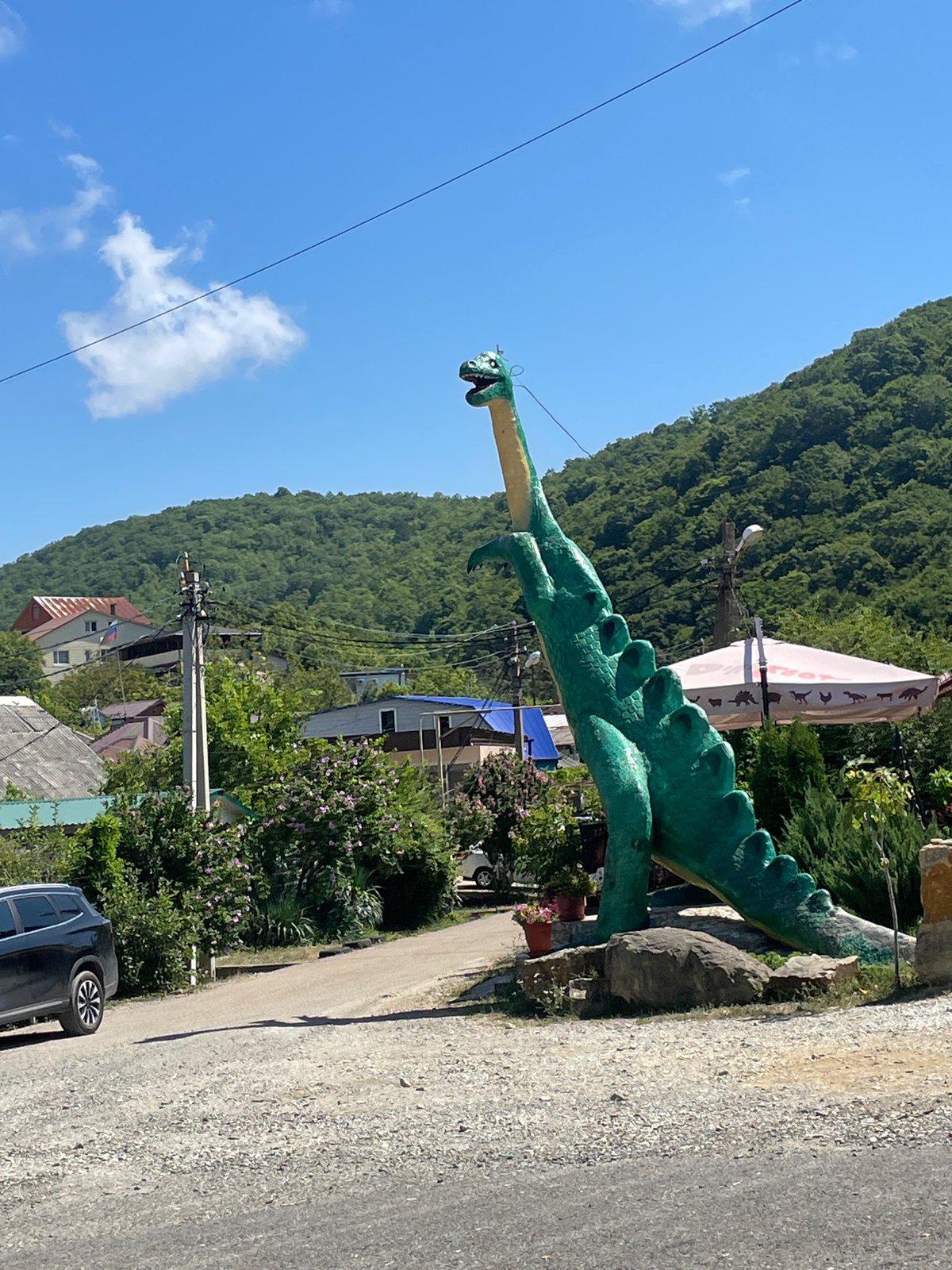 Giant Brontosaurus statue marks a roadside stop in Dzhubga, Russia