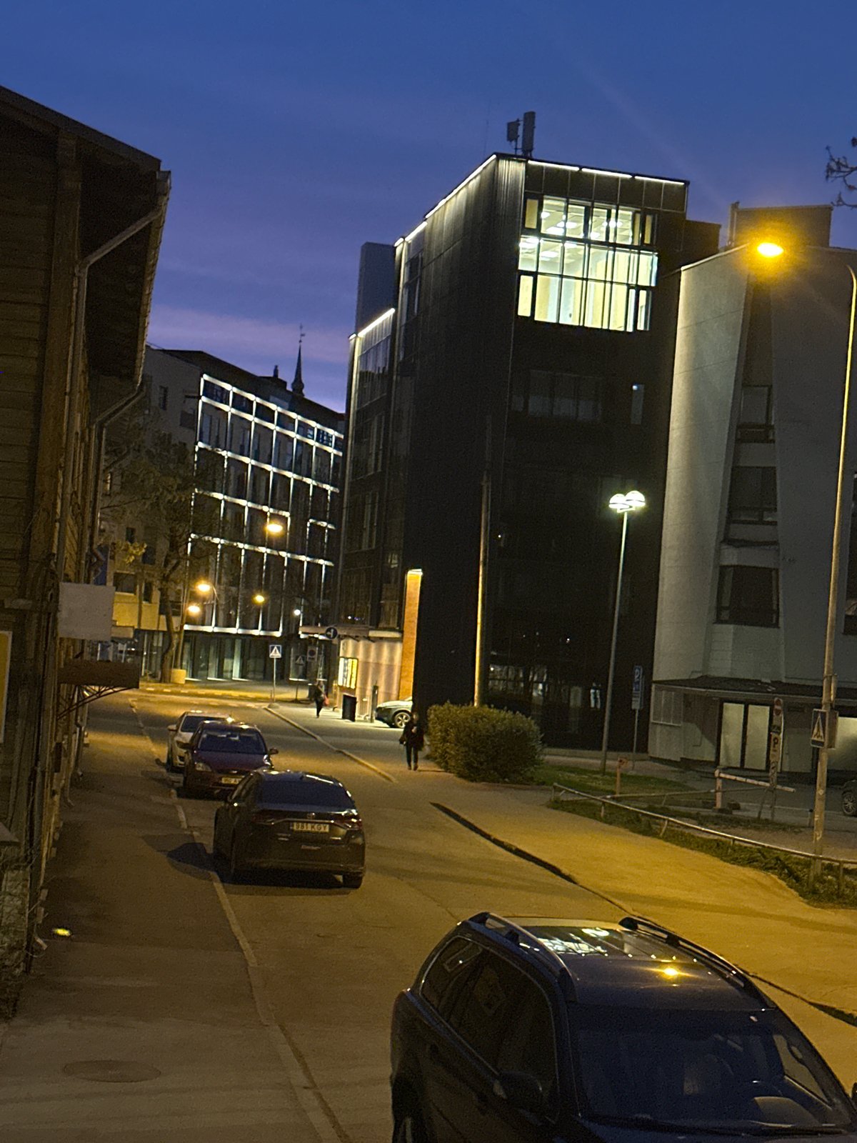 Illuminated modern building captured during Tallinn evening hours