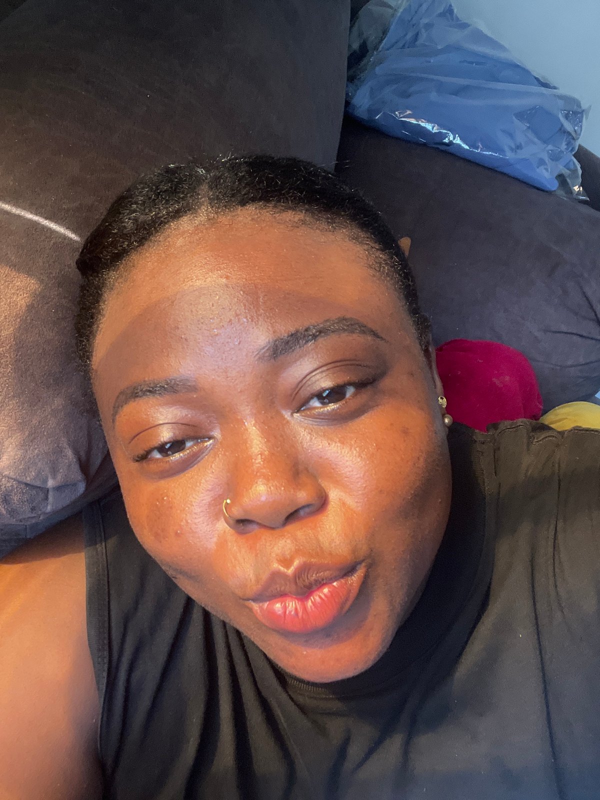 Woman photographed relaxing on sofa in Abuja home