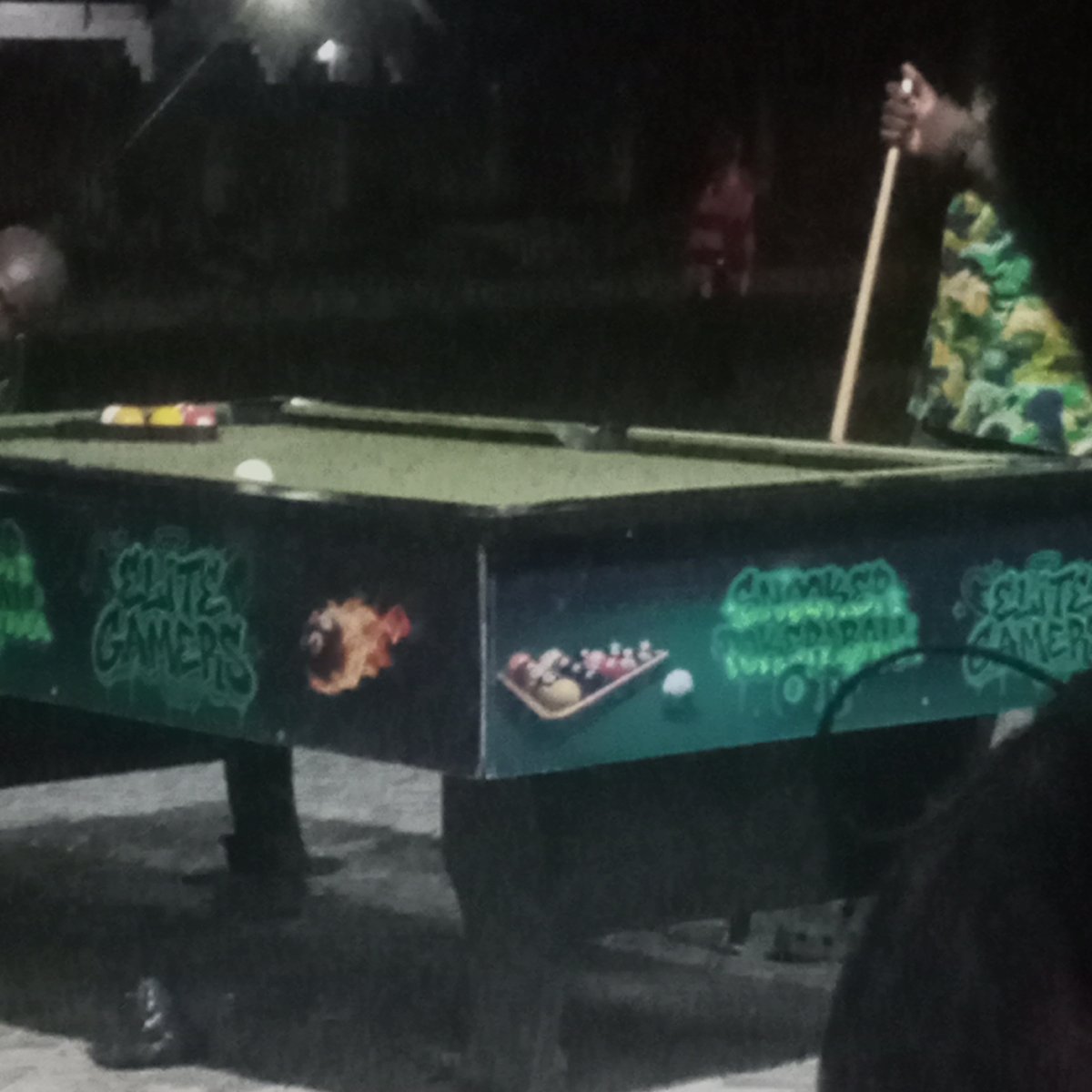 Outdoor gaming night: pool table, projected soccer, and PS5 controllers