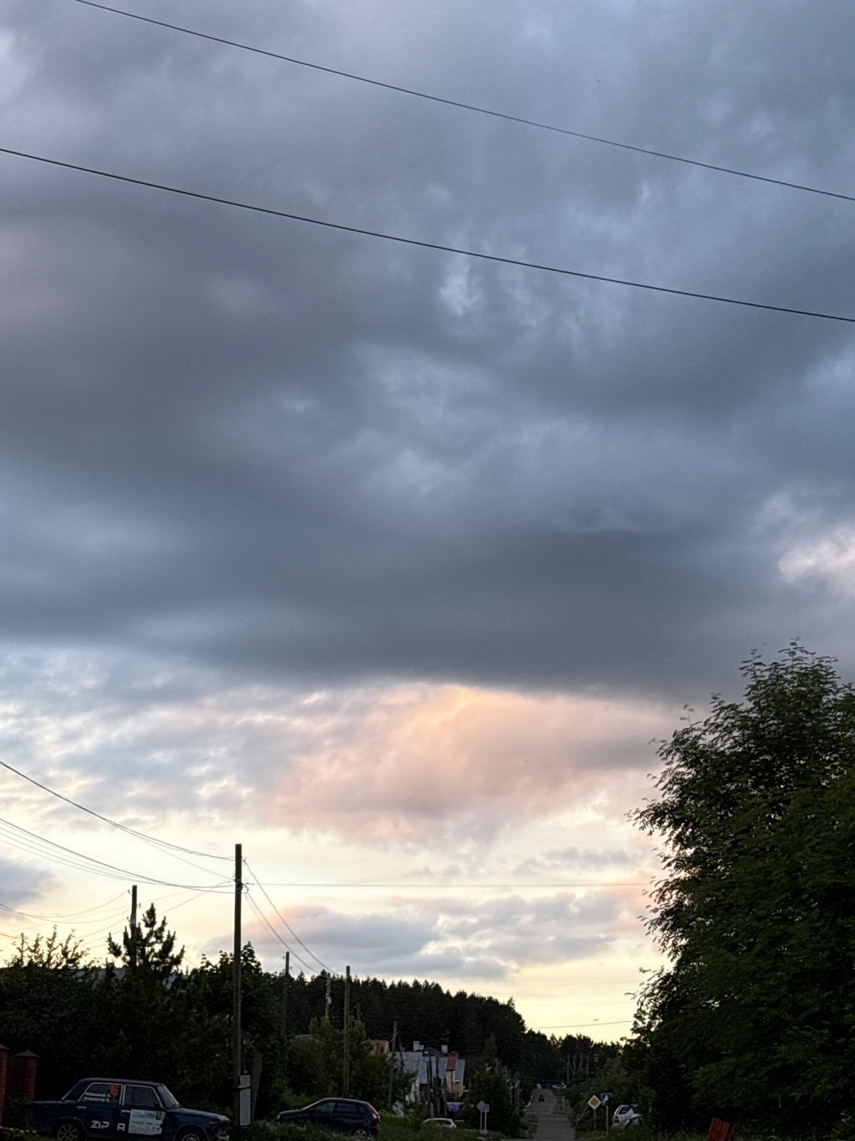 Overcast afternoon captures ordinary life in Прикамский, Russia