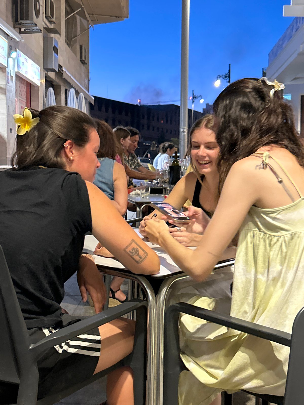 Evening dining scene captured at Málaga outdoor cafe