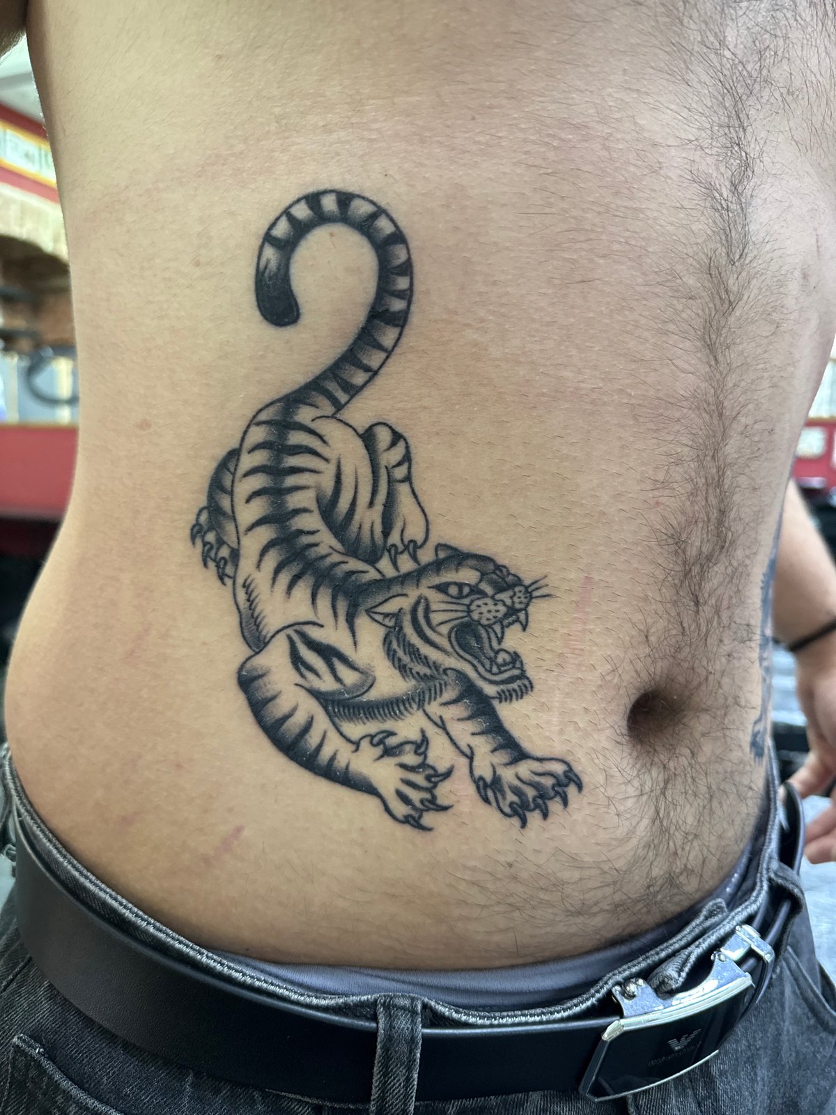 Moscow witnesses document person's torso featuring panther tattoo