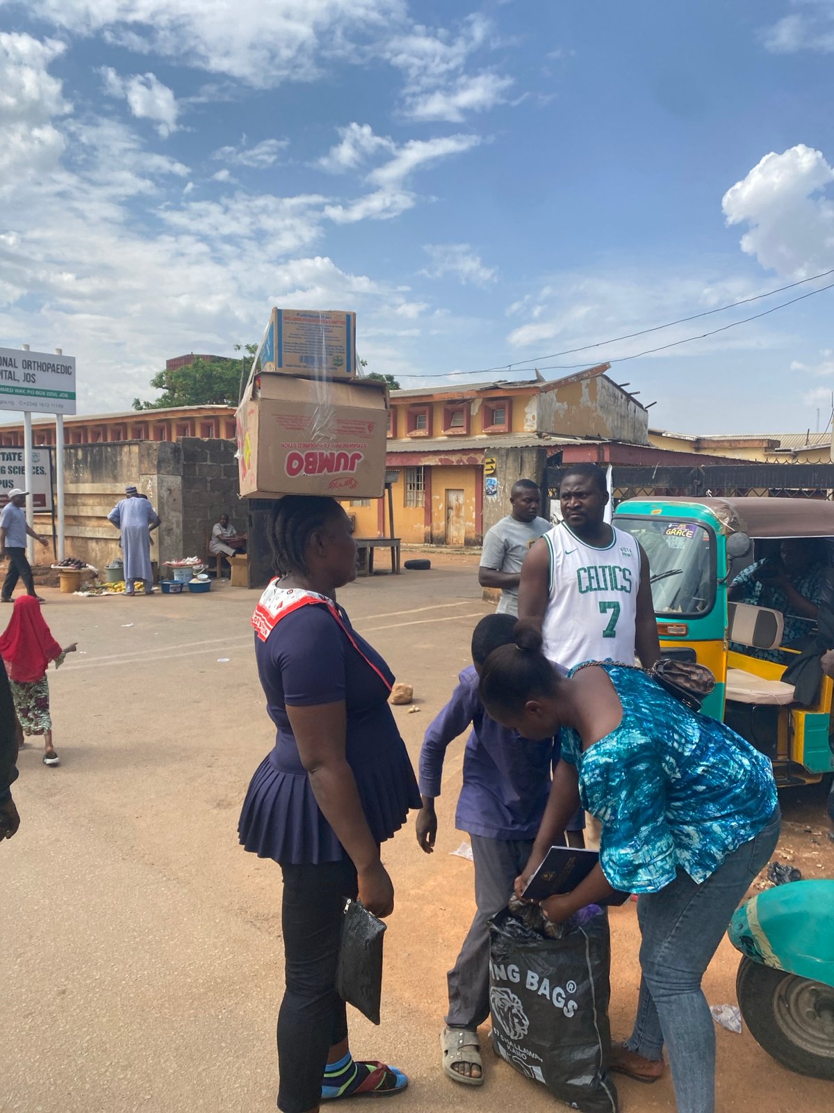 Daily street life documented in Jos, Nigeria commercial district