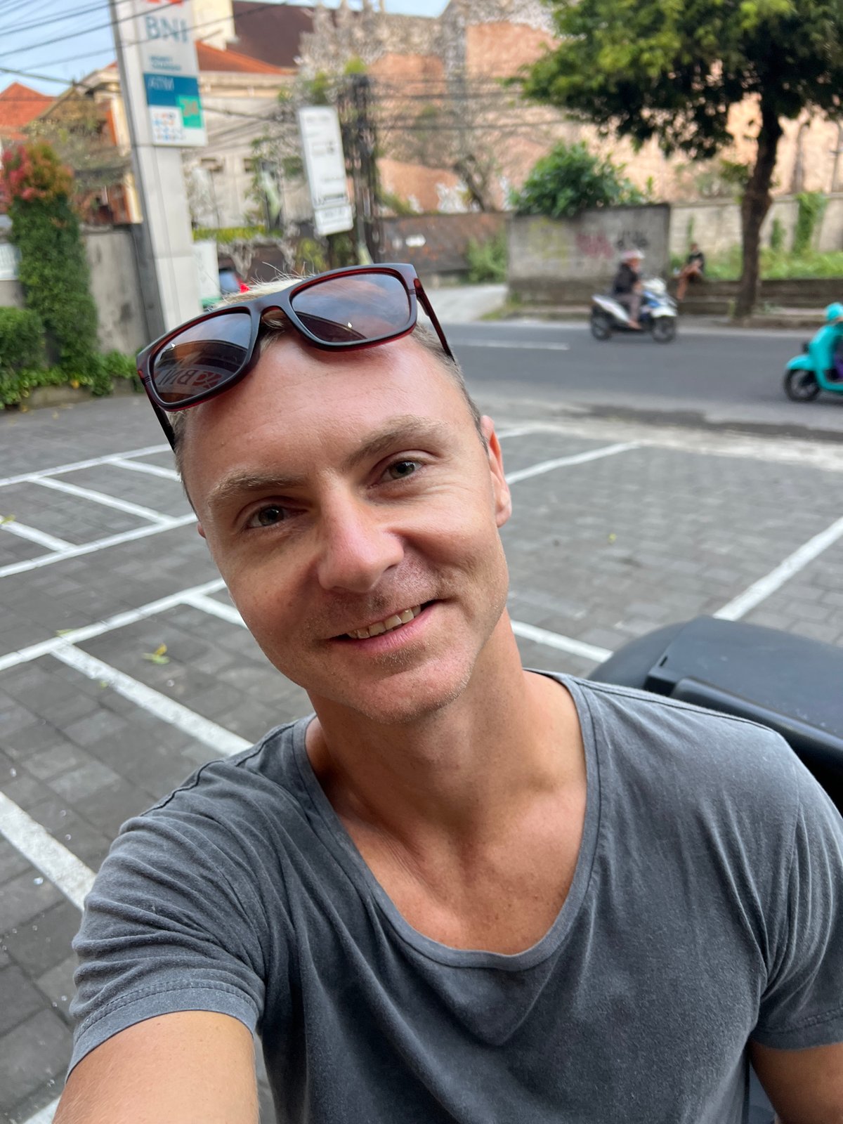 Banking errand at a Balinese BNI branch with a decorated scooter outside