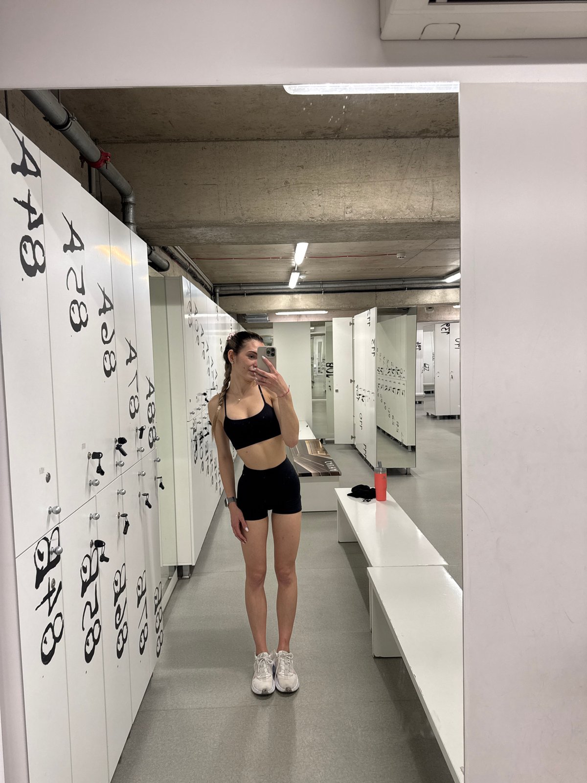 Woman takes fitness selfies in Sofia locker room
