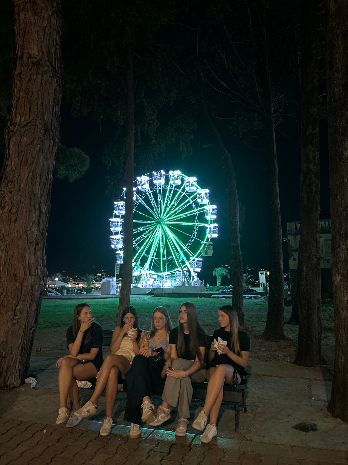 Nighttime Ferris wheel draws crowds in Budva, Montenegro