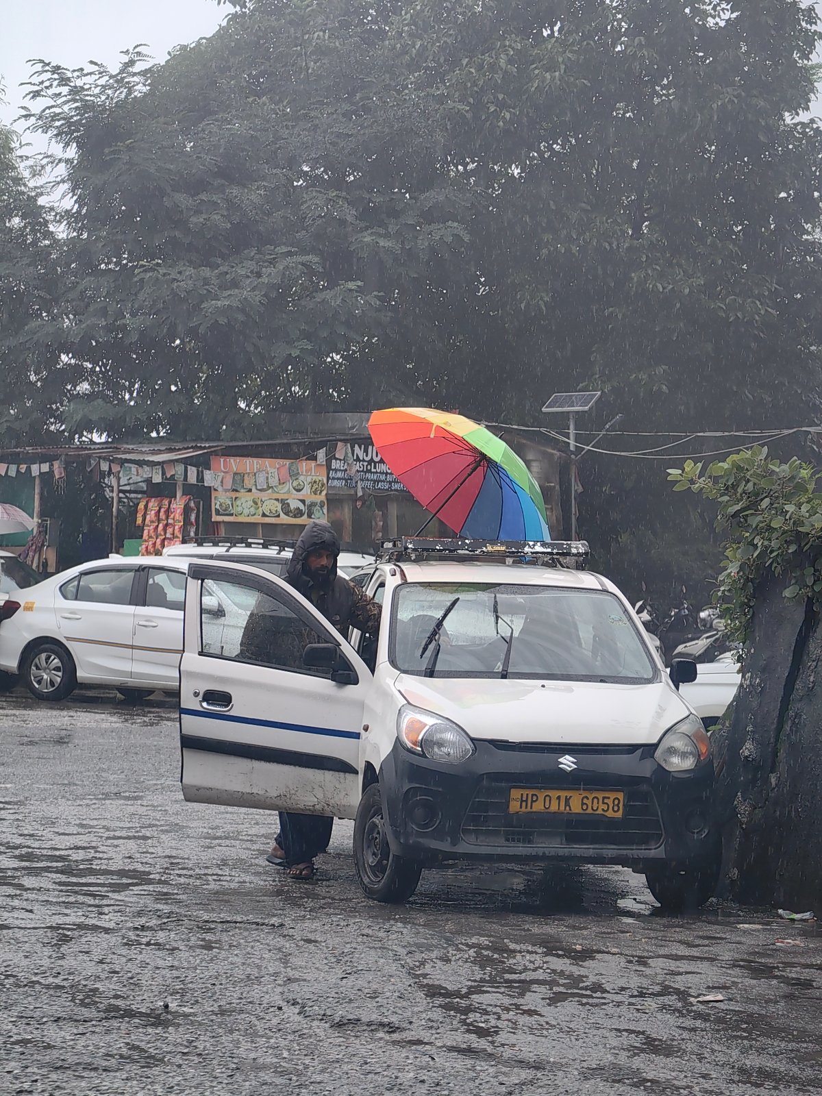 Rainy day street market life in Vashisht, India
