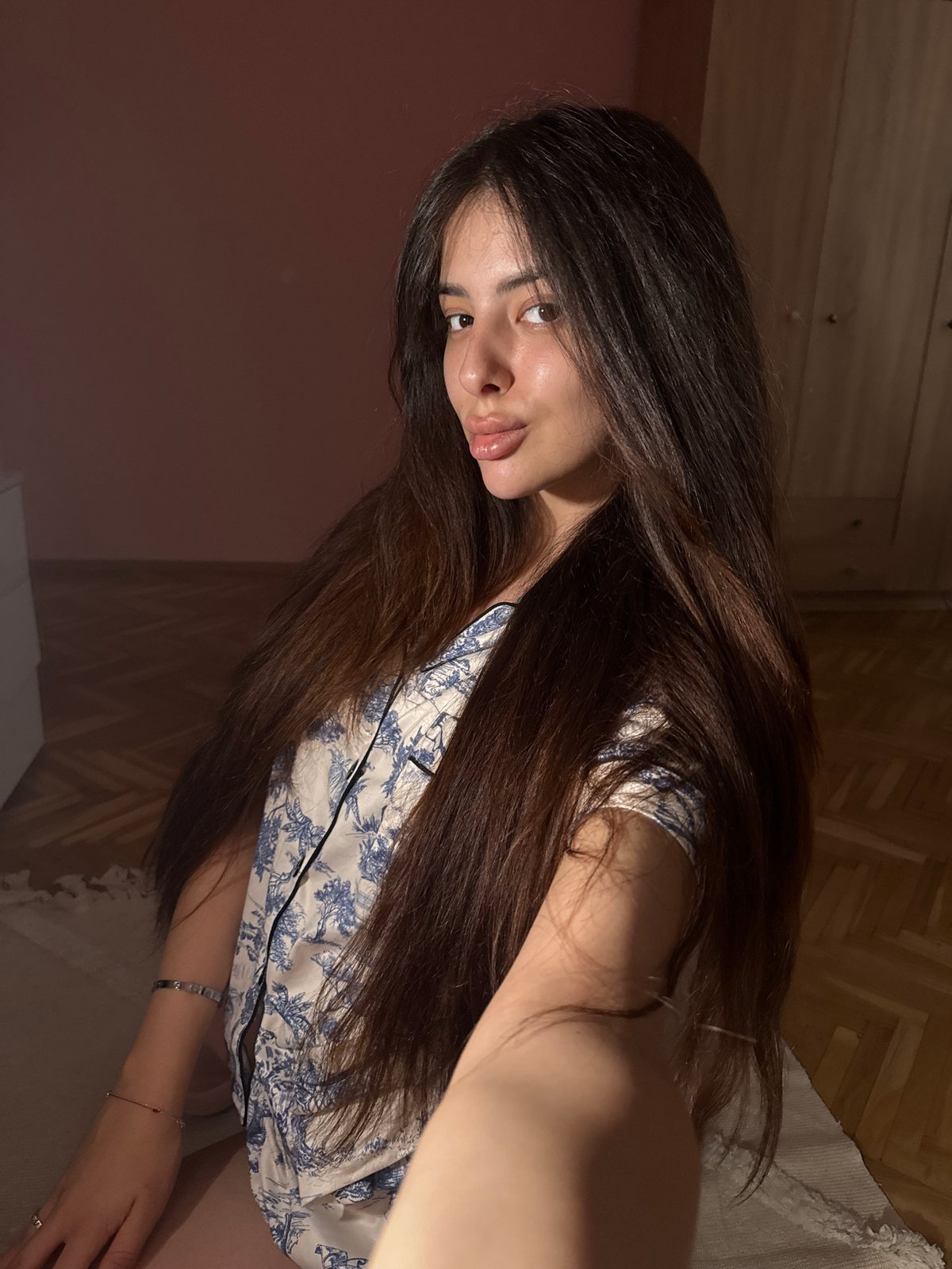Woman documents evening selfie session in Plovdiv bedroom