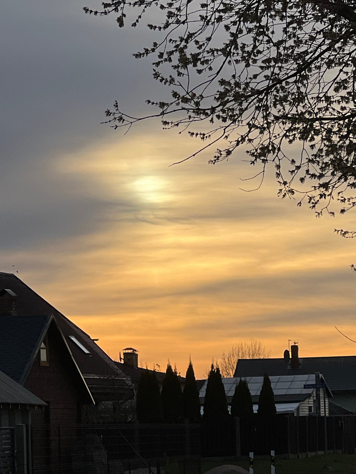 Dramatic sunset illuminates Riga streets and gardens
