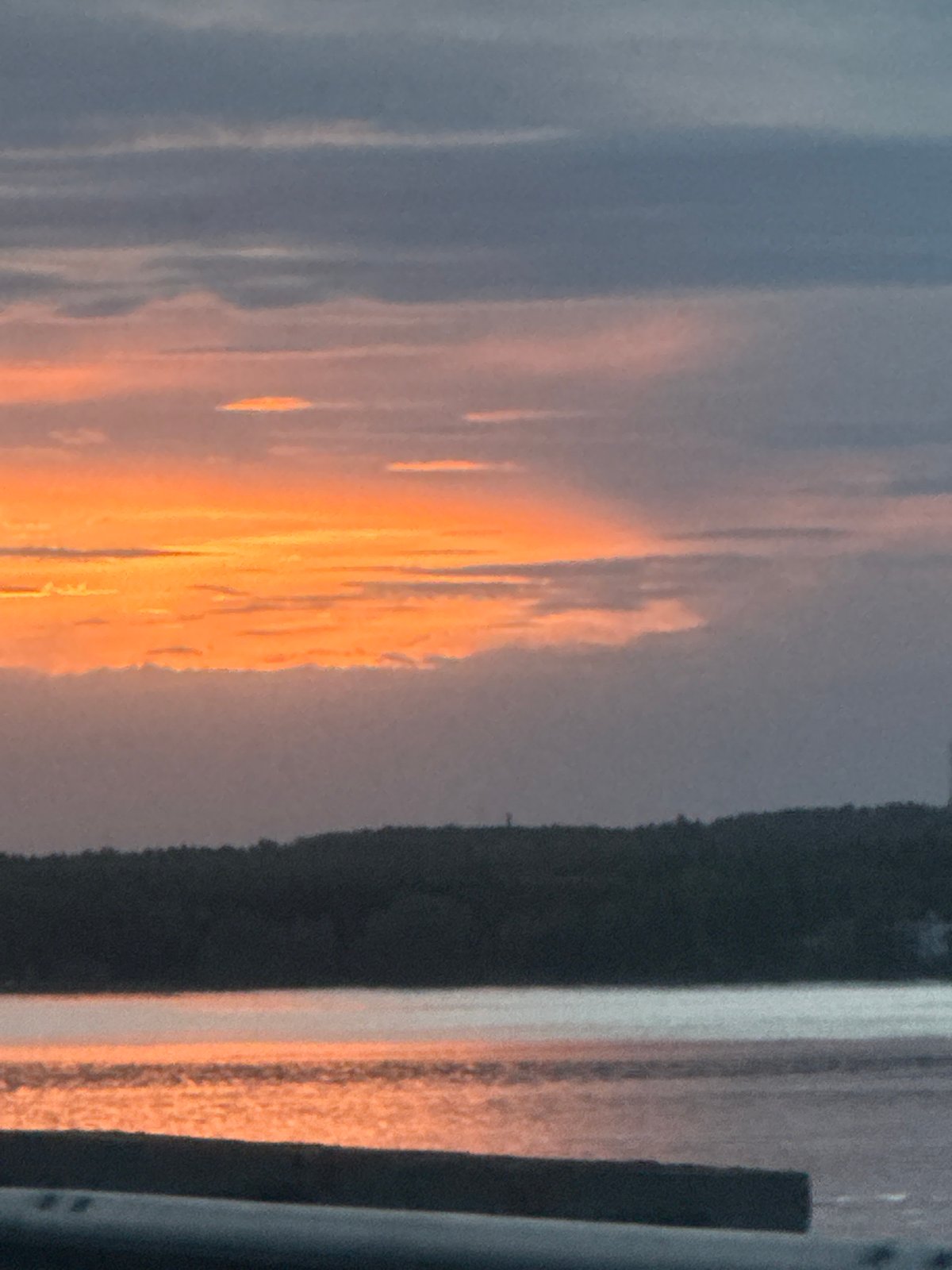 Sunset observed over water in Chaikovsky, Russia