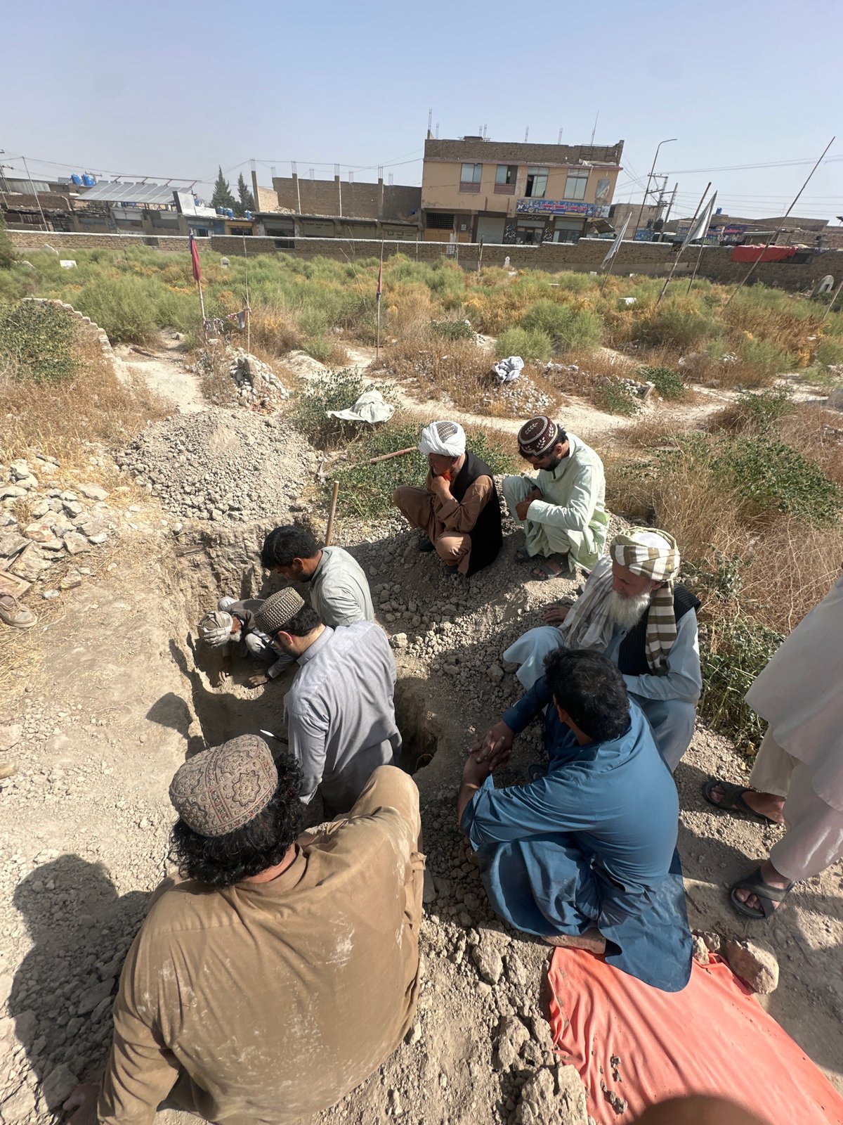 Grave being dug in dry terrain, Quetta, Pakistan