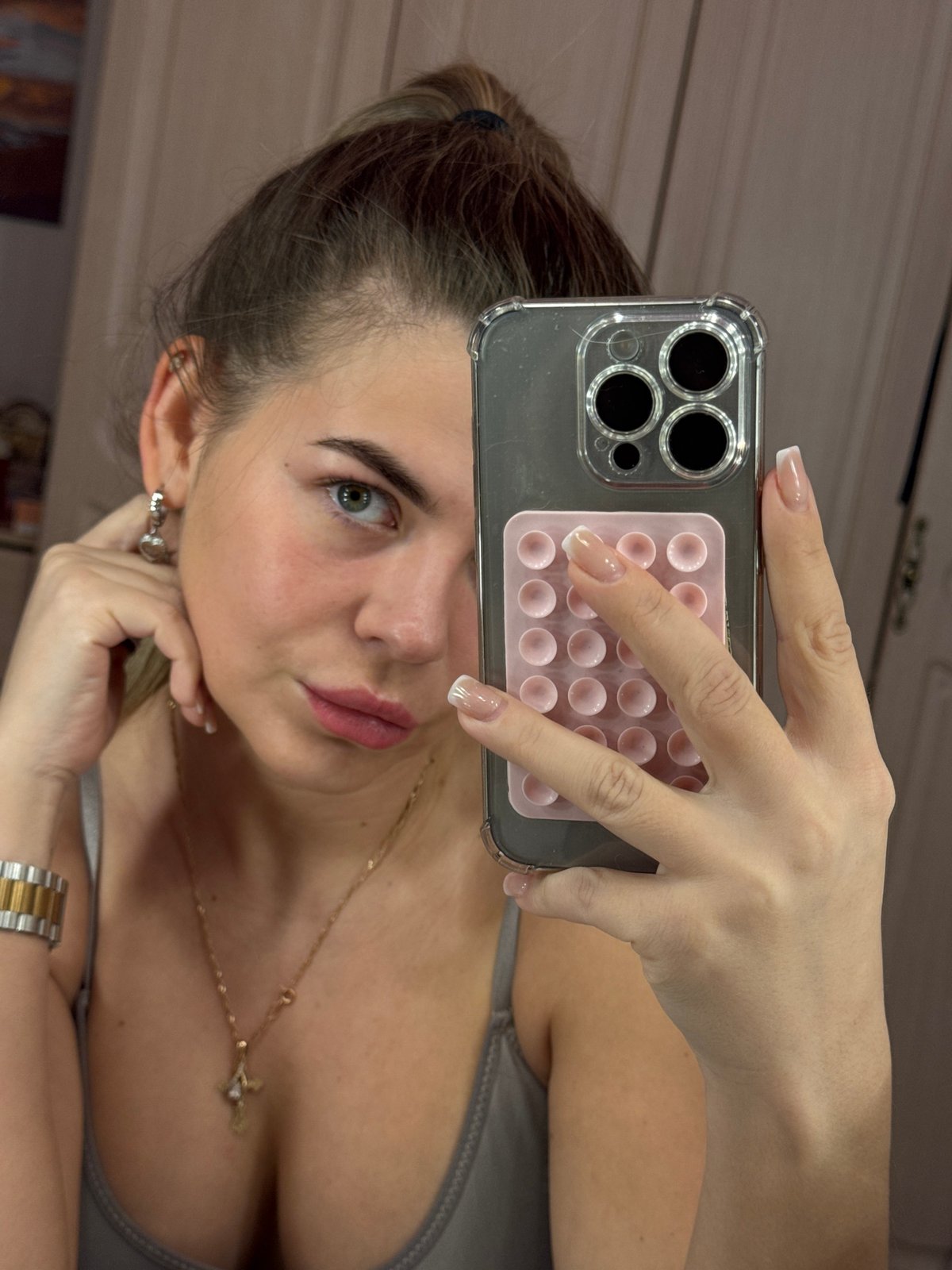 Woman takes mirror selfies in Chaikovsky, Russia evening