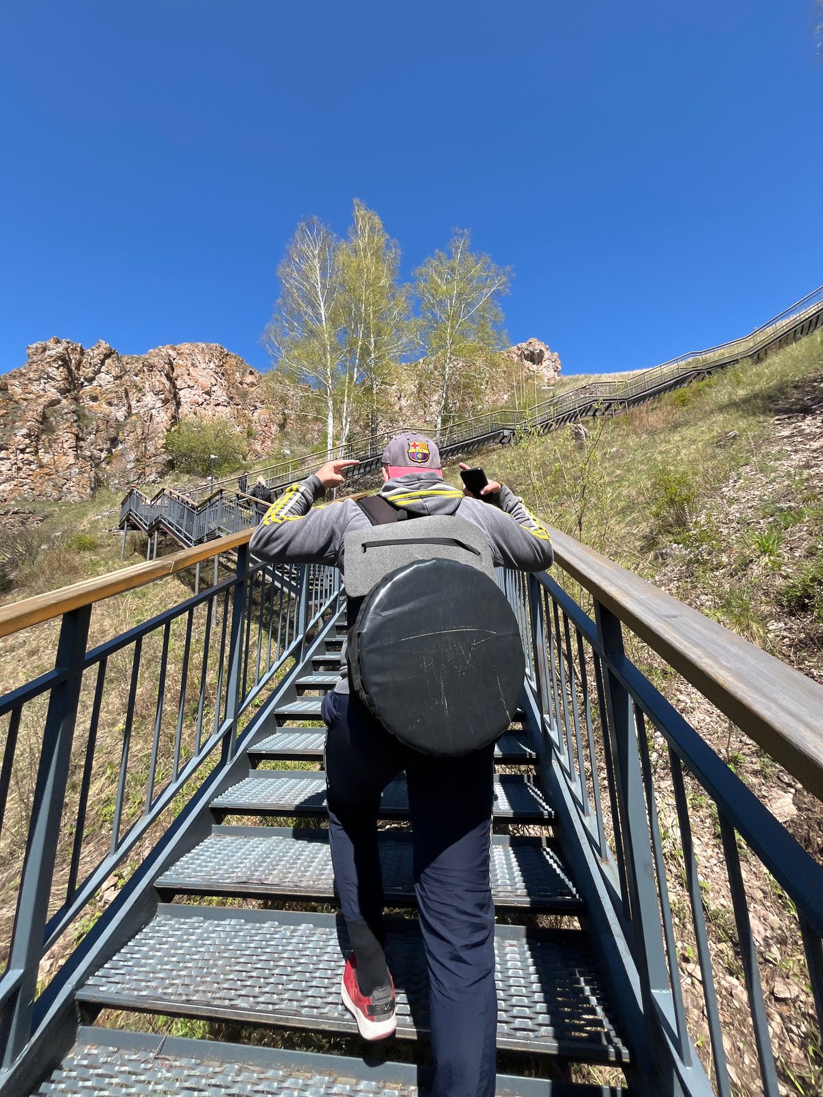 Morning visitors climb Torgashinsky Ridge staircase in Krasnoyarsk