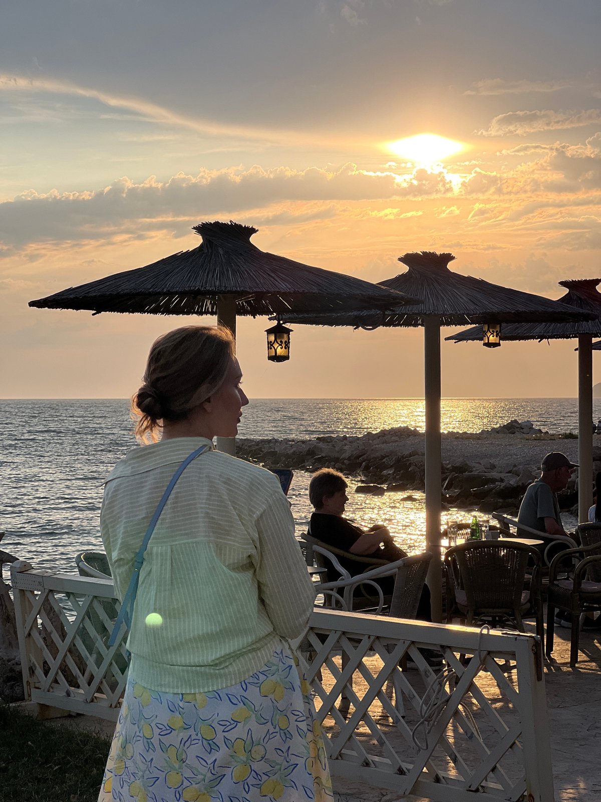 Women enjoy evening coastal views in Bar, Montenegro