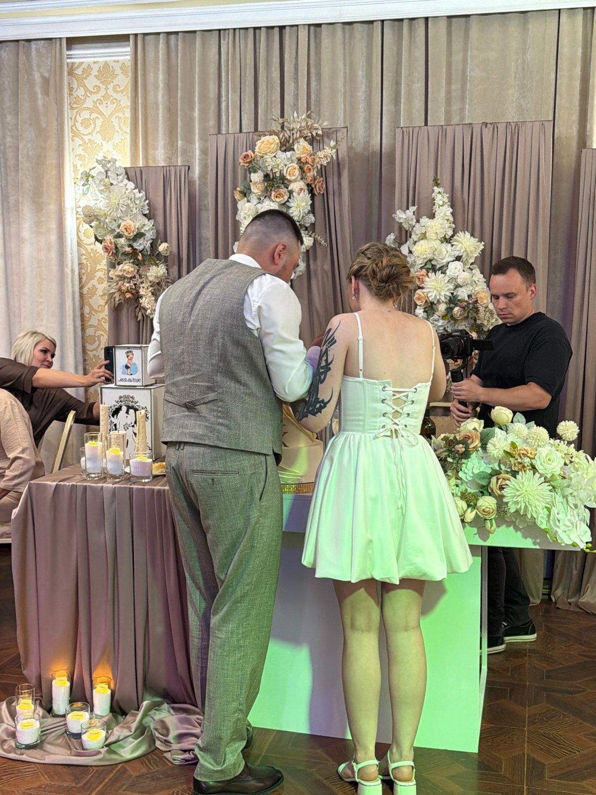 Wedding reception cake cutting ceremony in Chernushka, Russia