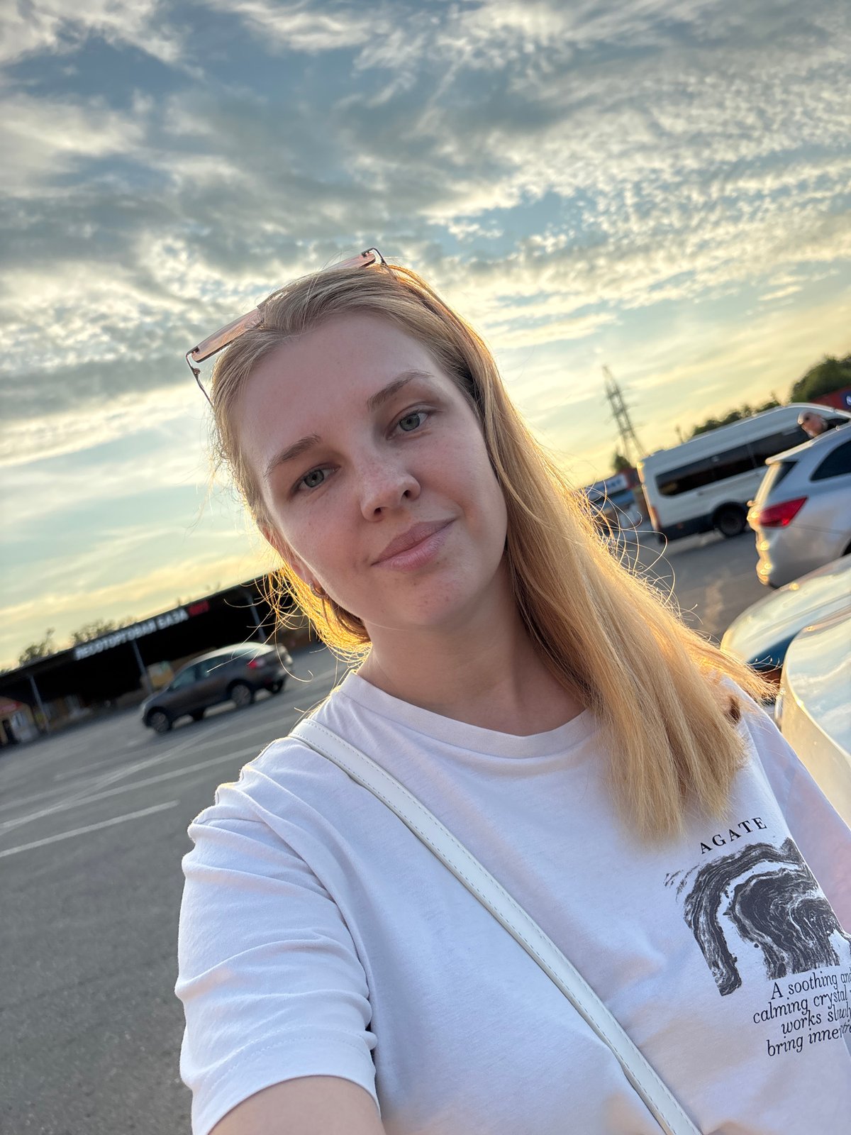 Parking lot pause at sunset, selfies and a toy in hand