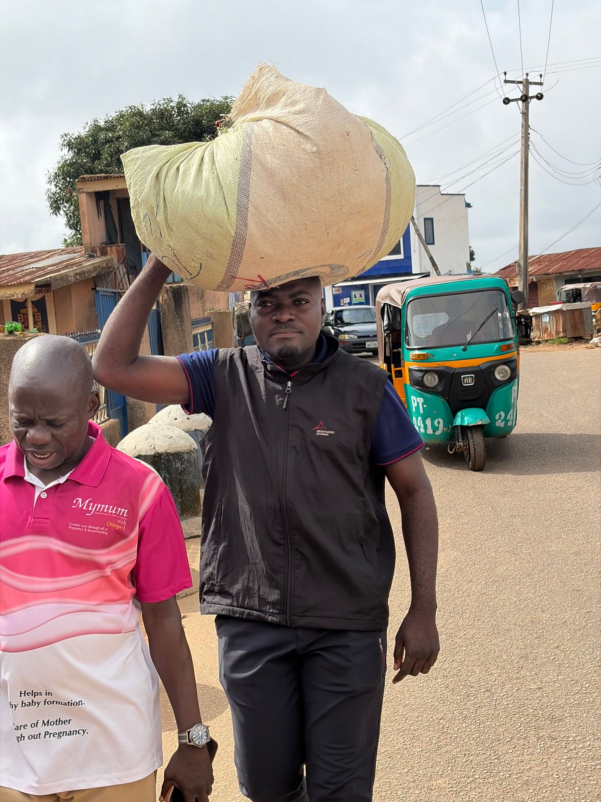Everyday street life moving through Jos on a weekday morning