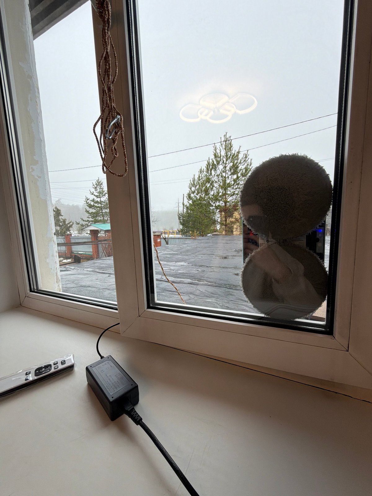 Window-cleaning robot operates in foggy Chaikovsky, Russia