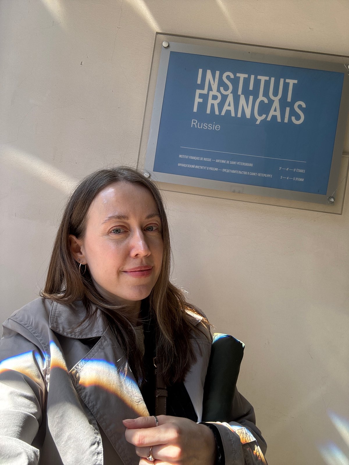 Woman takes selfie at French Institute in Saint Petersburg