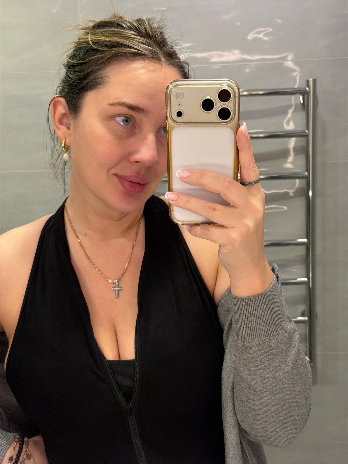 Woman takes selfies indoors in Dolgoprudny, Russia
