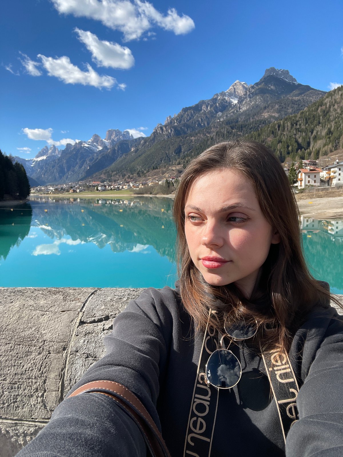 Tourist selfie session at Italian Alpine lake destination