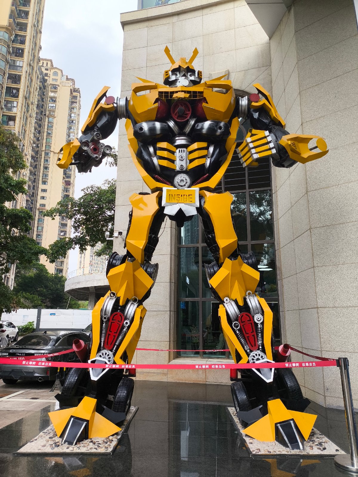 Giant robot statues including Optimus Prime displayed in Longgang