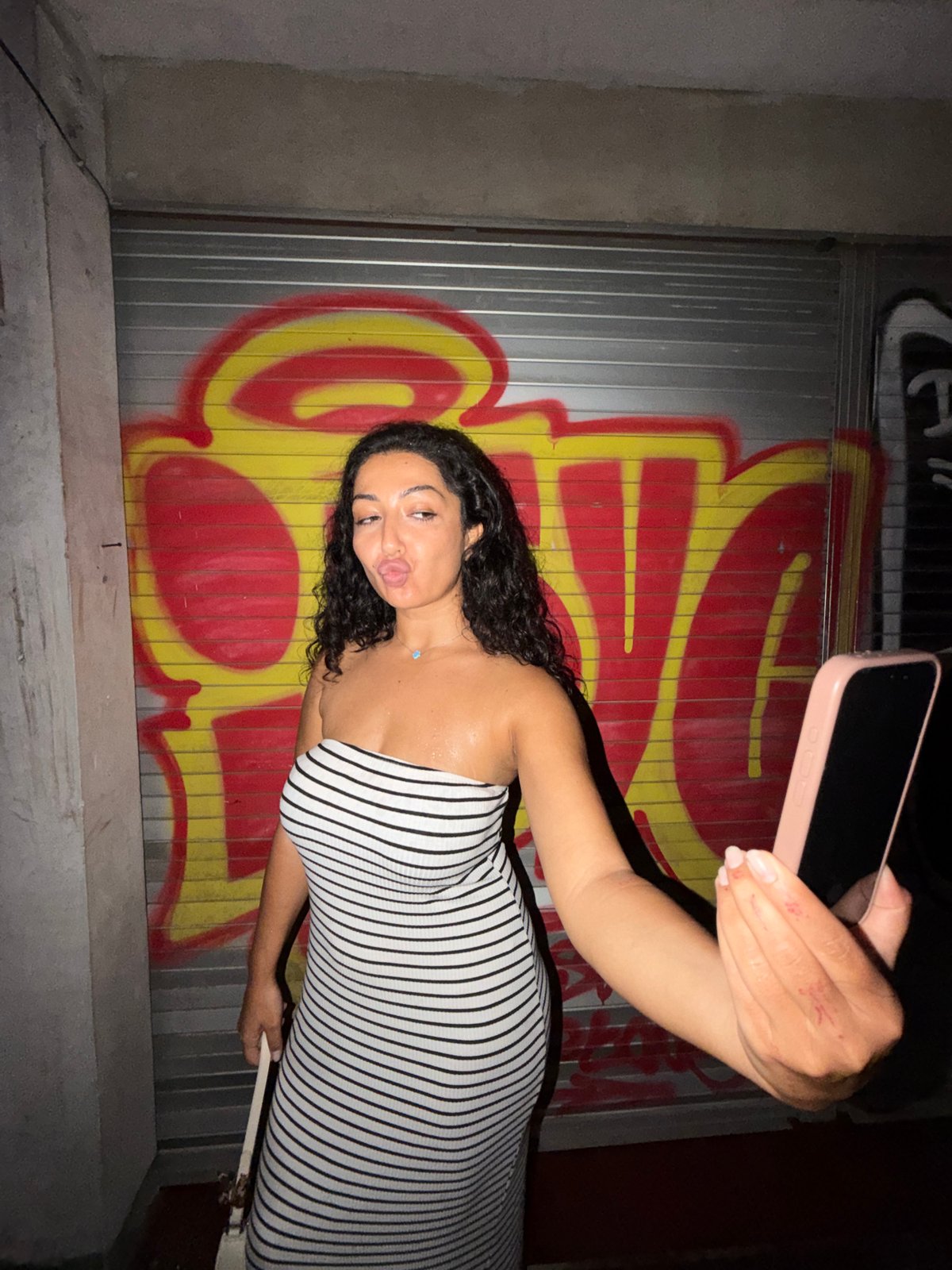 Nighttime photoshoot against graffiti walls in Mengwi, Indonesia