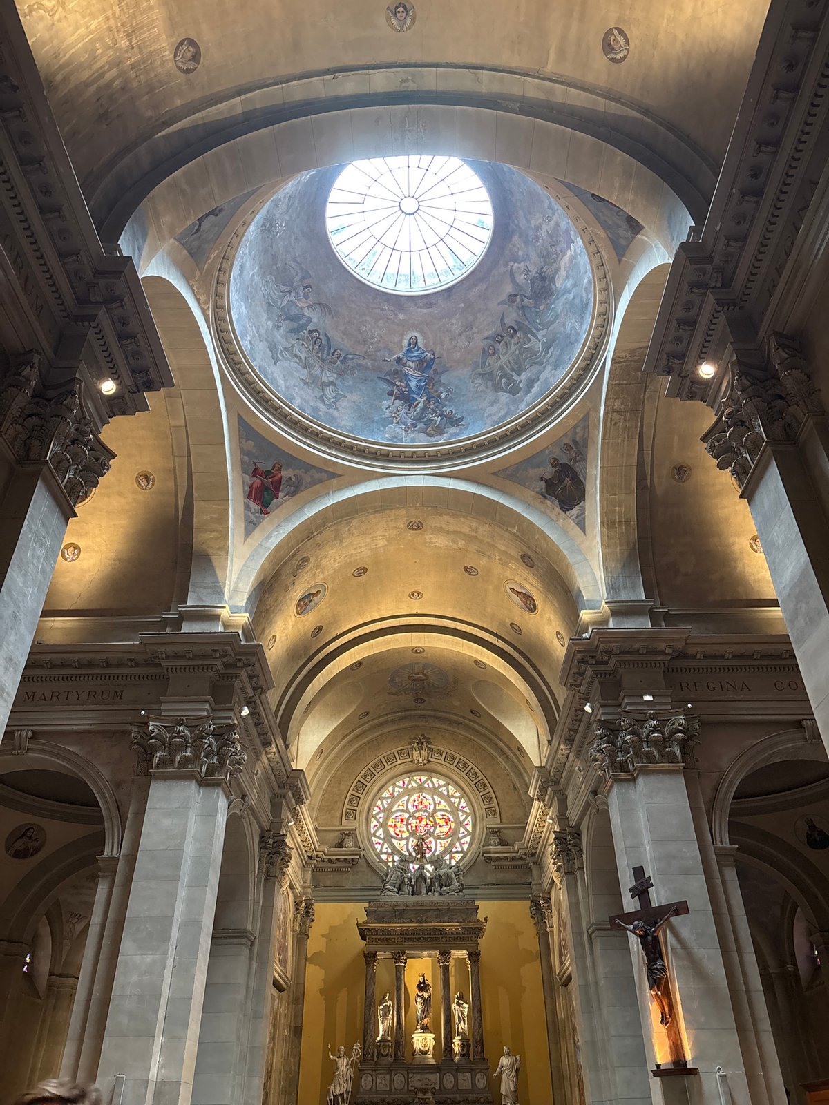 Tourist photographs historic church interior and exterior in Annecy