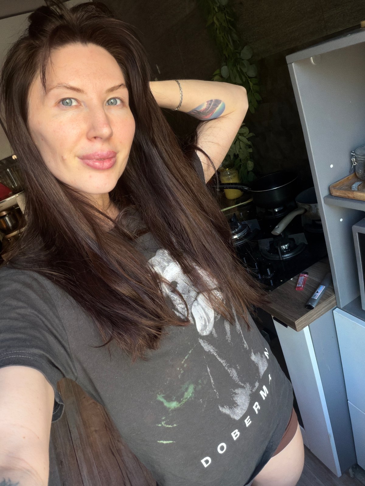 Woman photographed with Stanley tumbler in Perm kitchen