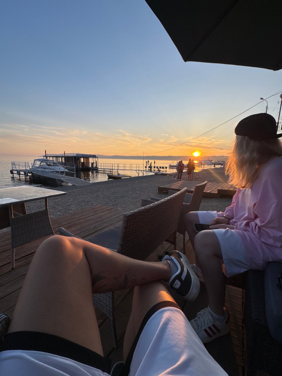 Sunset drinks and a boat called Опричник on Lake Baikal