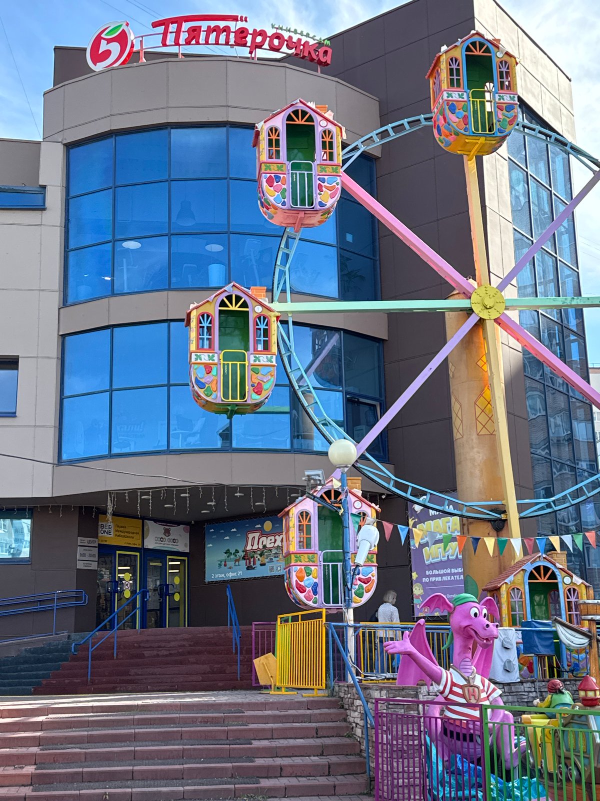 Urban life documented near Russian grocery store, markets, transit