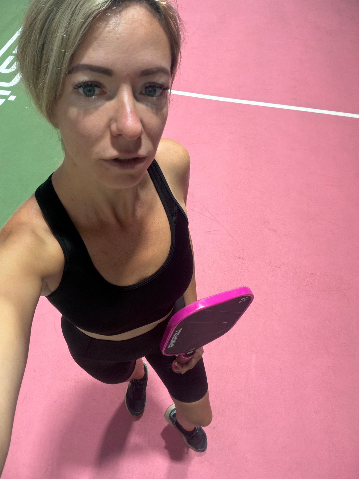 Selfies on a pink pickleball court in Da Lat, Vietnam