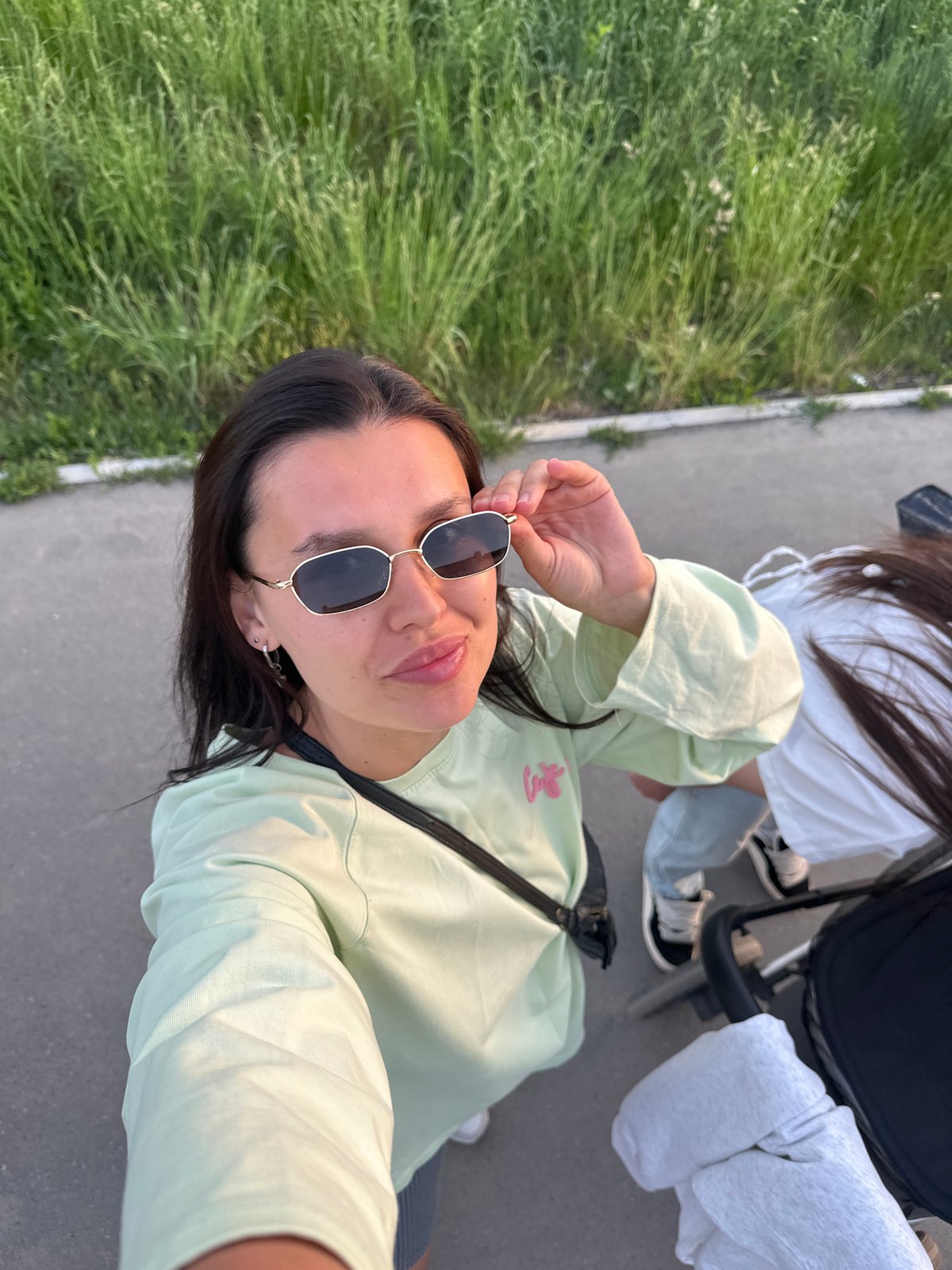 Friends take sunset selfies during stroll in Chaikovsky, Russia