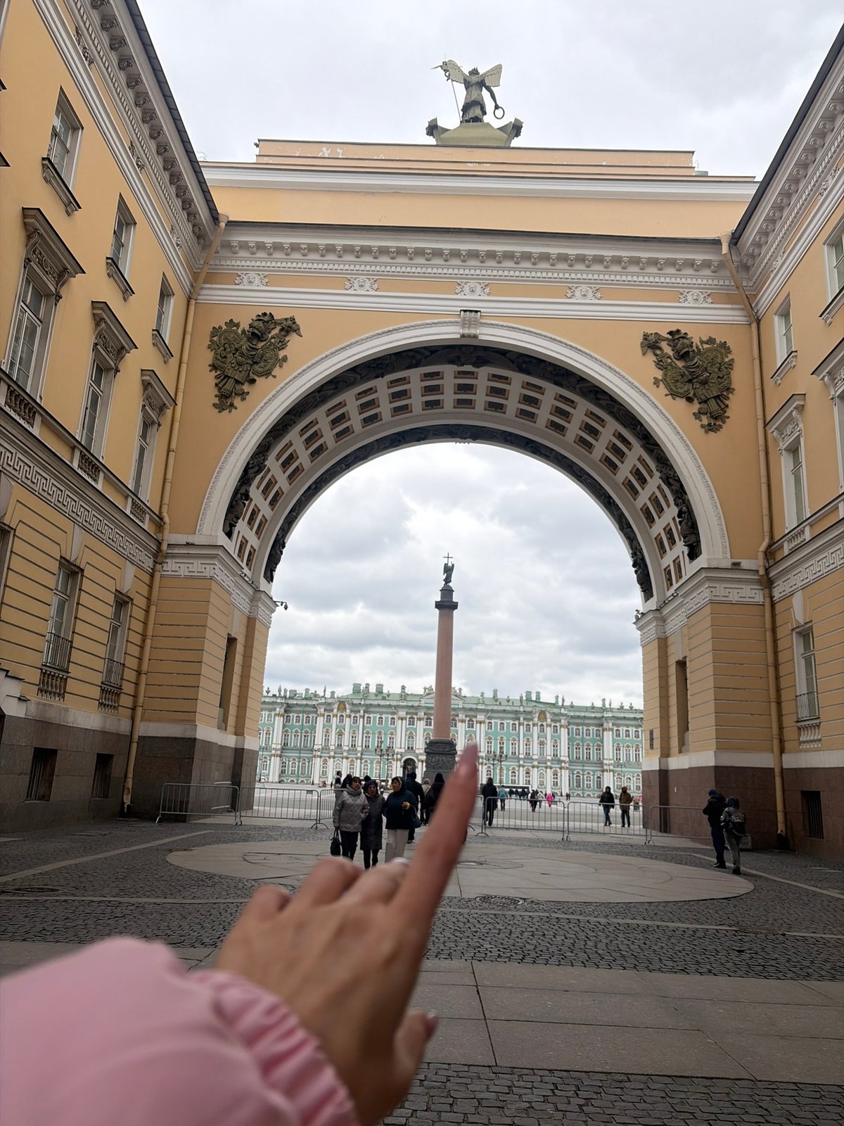 Tourist documents Palace Square architecture during morning walkthrough