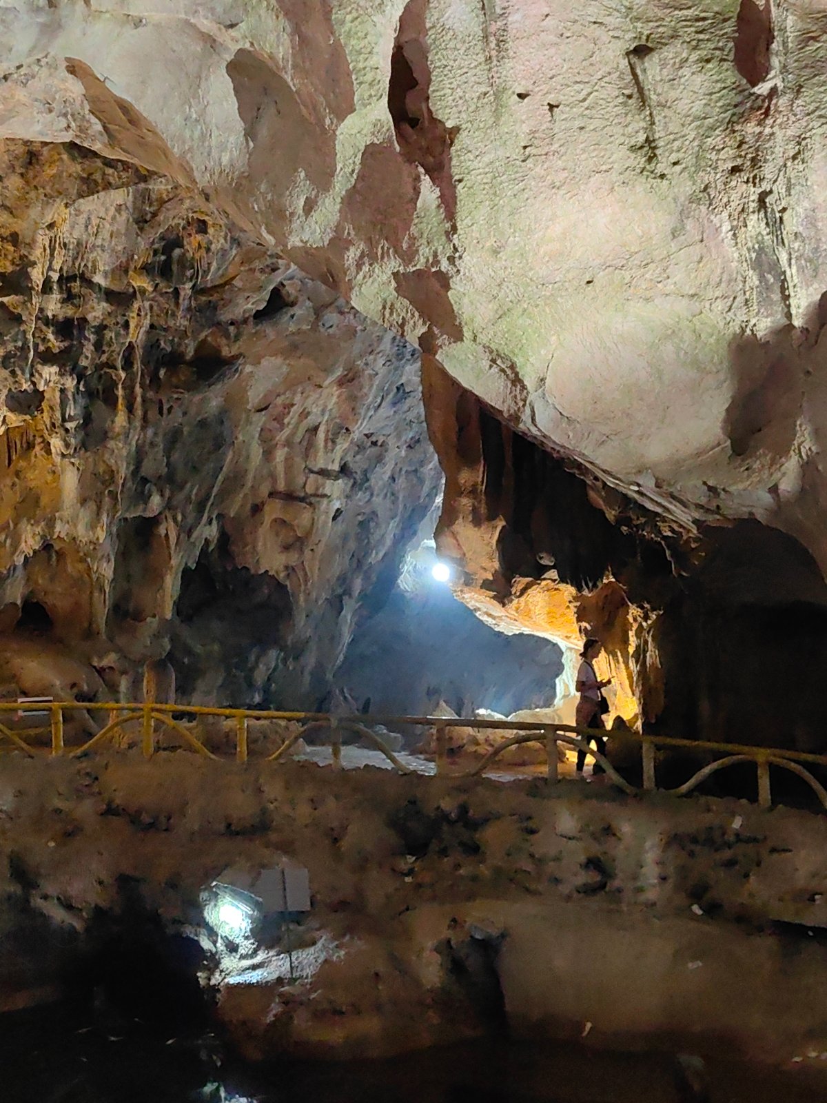 Tourist explores cave formations in Lạng Sơn, Vietnam