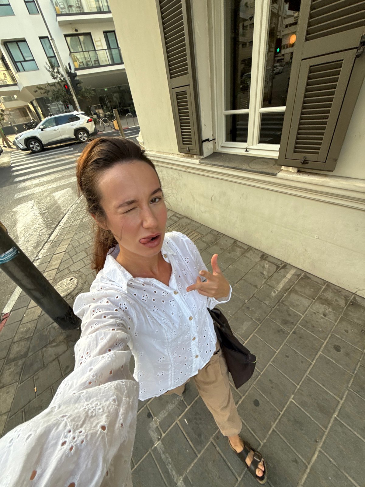 Selfie session around Tel Aviv, sidewalk to shop