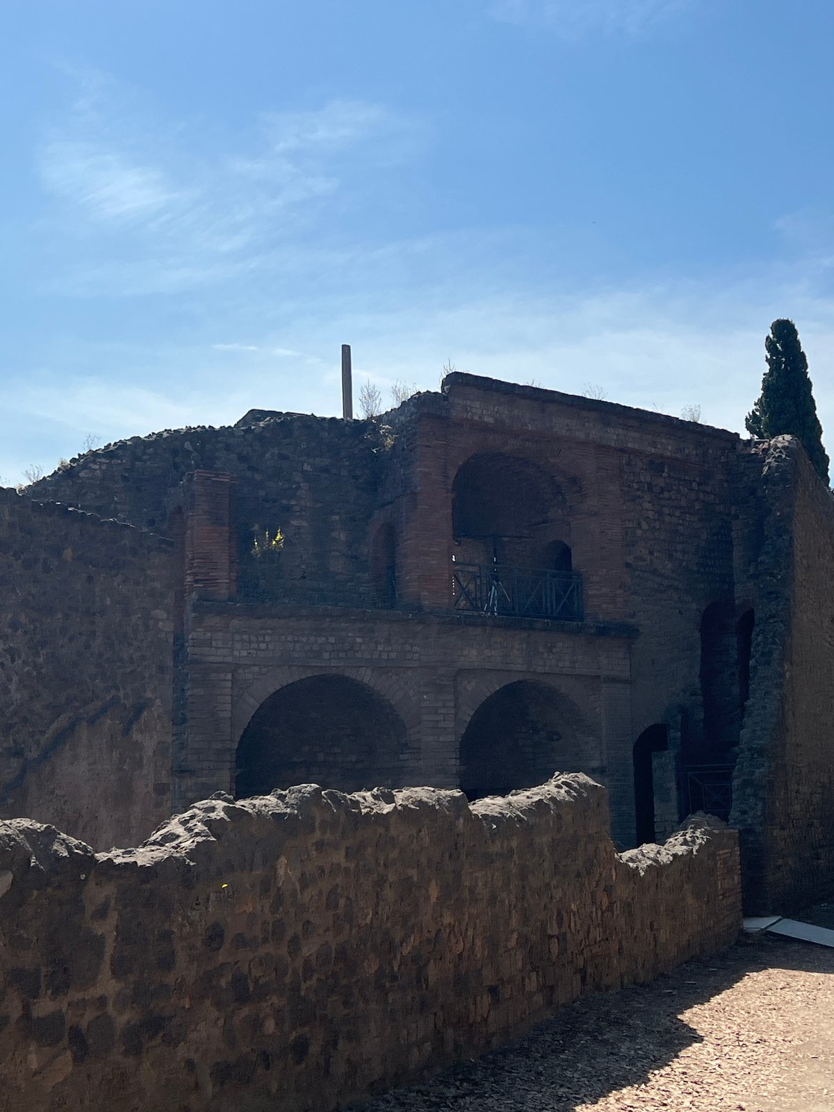 Tourist documents Pompeii ruins during morning visit in Italy